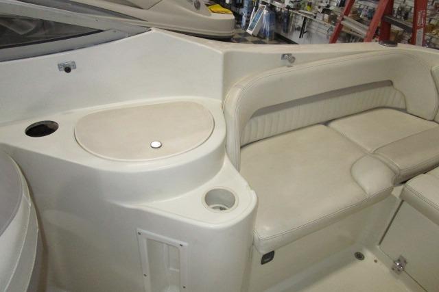 2004 Stingray 240 LR boat interior with seating and storage compartments.
