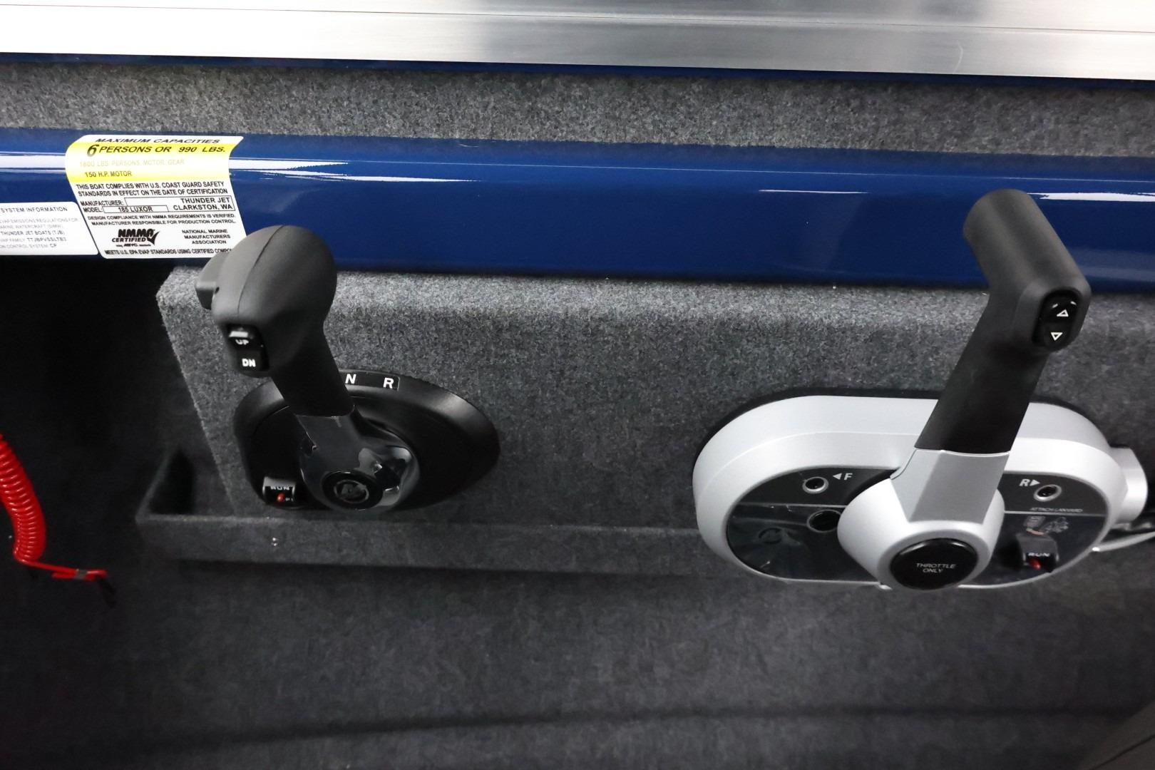 2026 Thunder Jet 185 Luxor boat controls with dual throttle levers and capacity label.