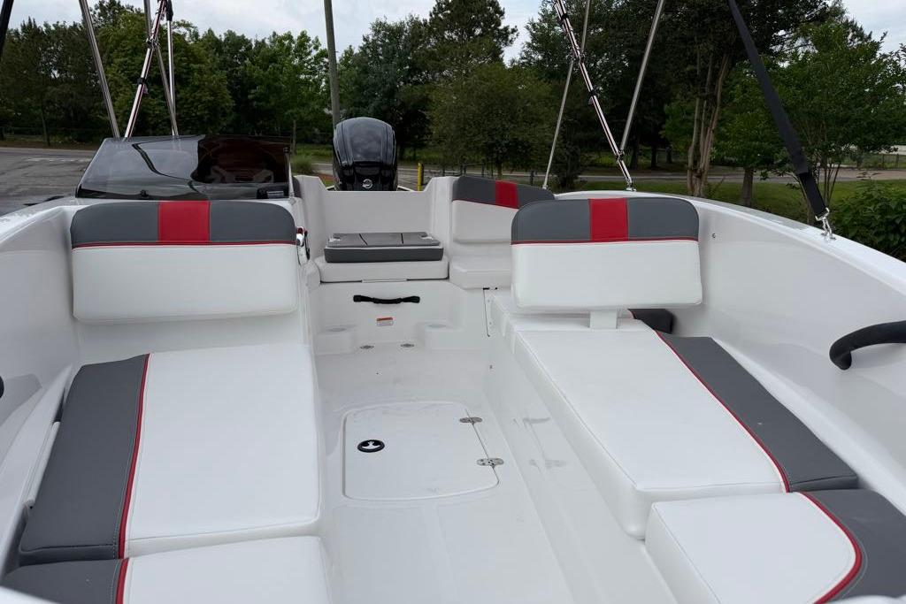2026 Tahoe T16 boat interior with white and gray seating, red accents, and sleek design.