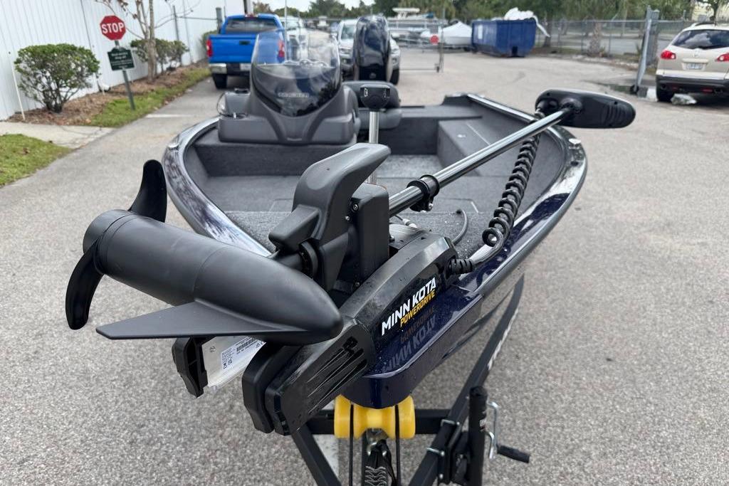 2026 Nitro Z17 boat with Minn Kota PowerDrive trolling motor in a parking lot.