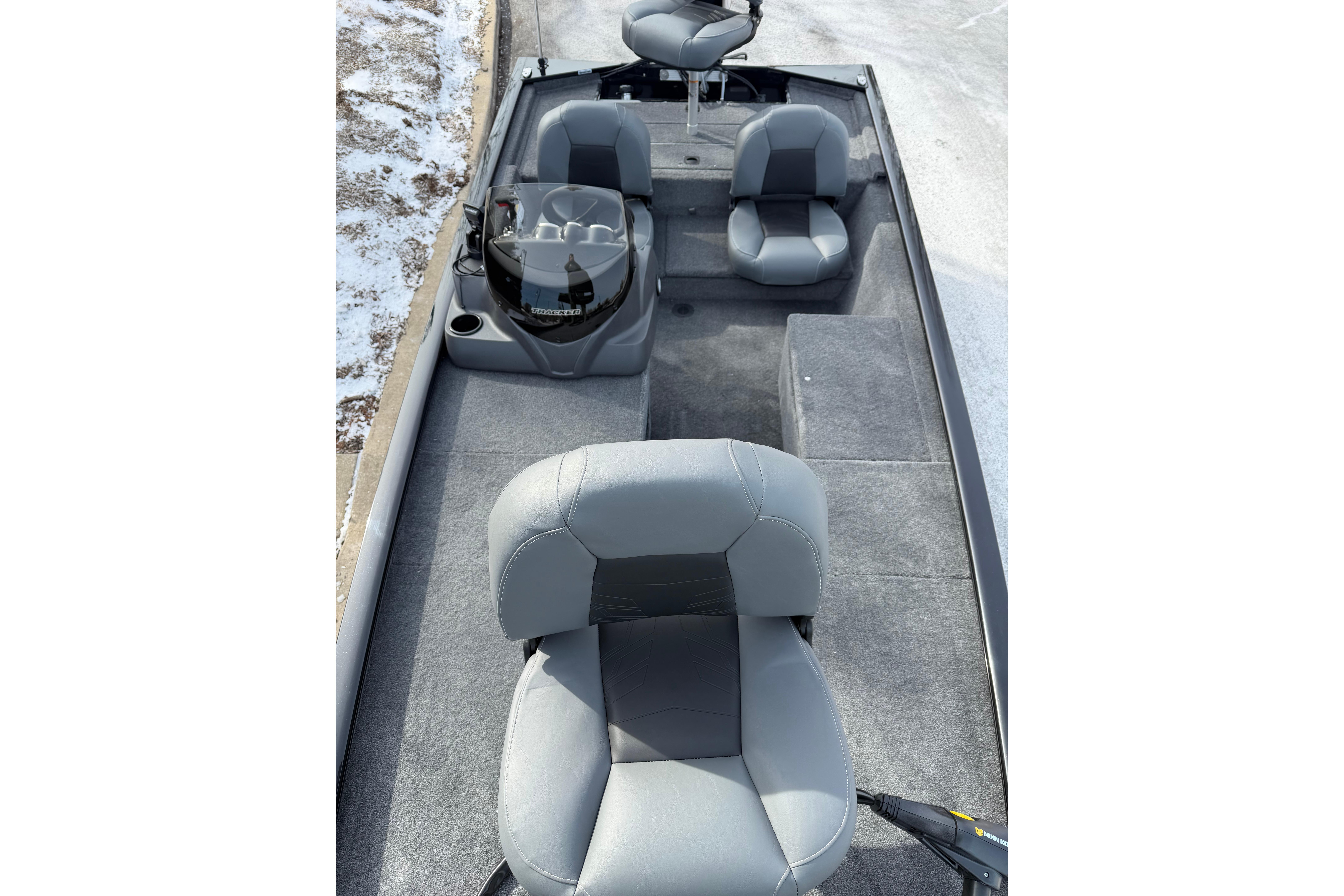 2026 Tracker Pro 170 boat interior with gray seating and carpeted flooring.