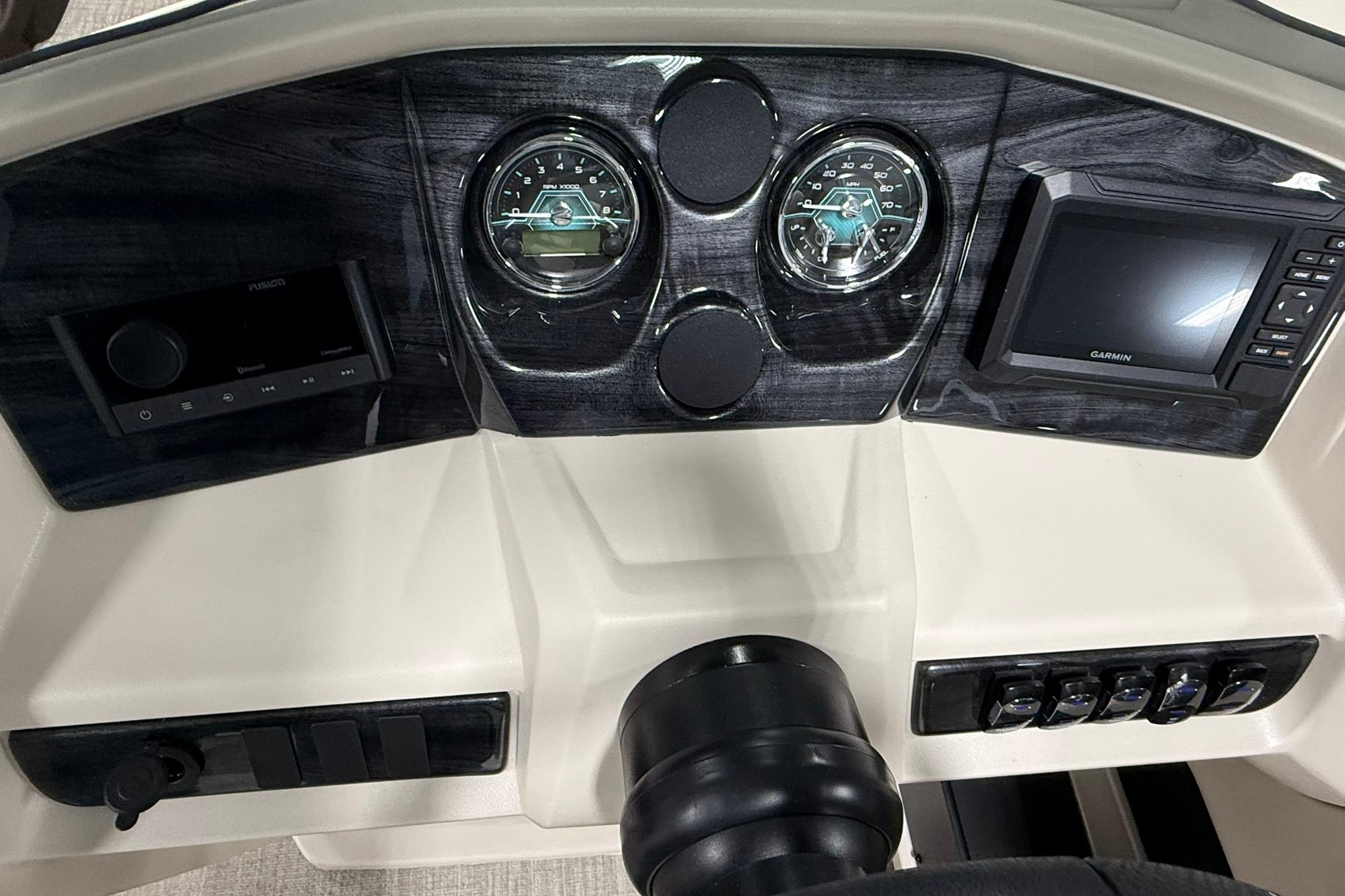 Dashboard of 2026 Avalon LSZ Elite 21' with gauges and Garmin display.