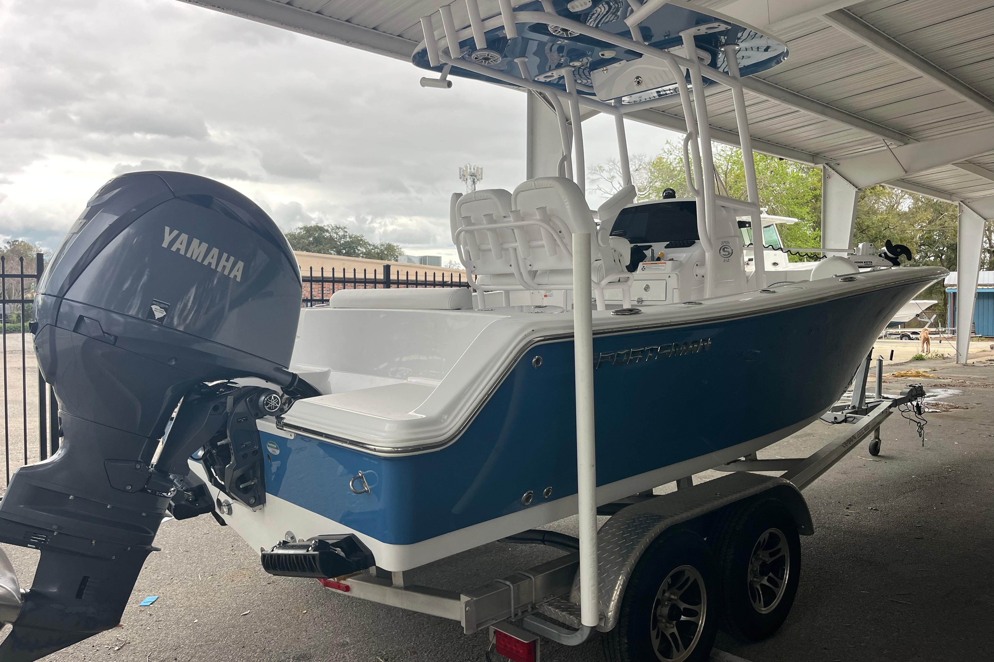 2024 Sportsman Open 212 Center Console boat with Yamaha engine on trailer.