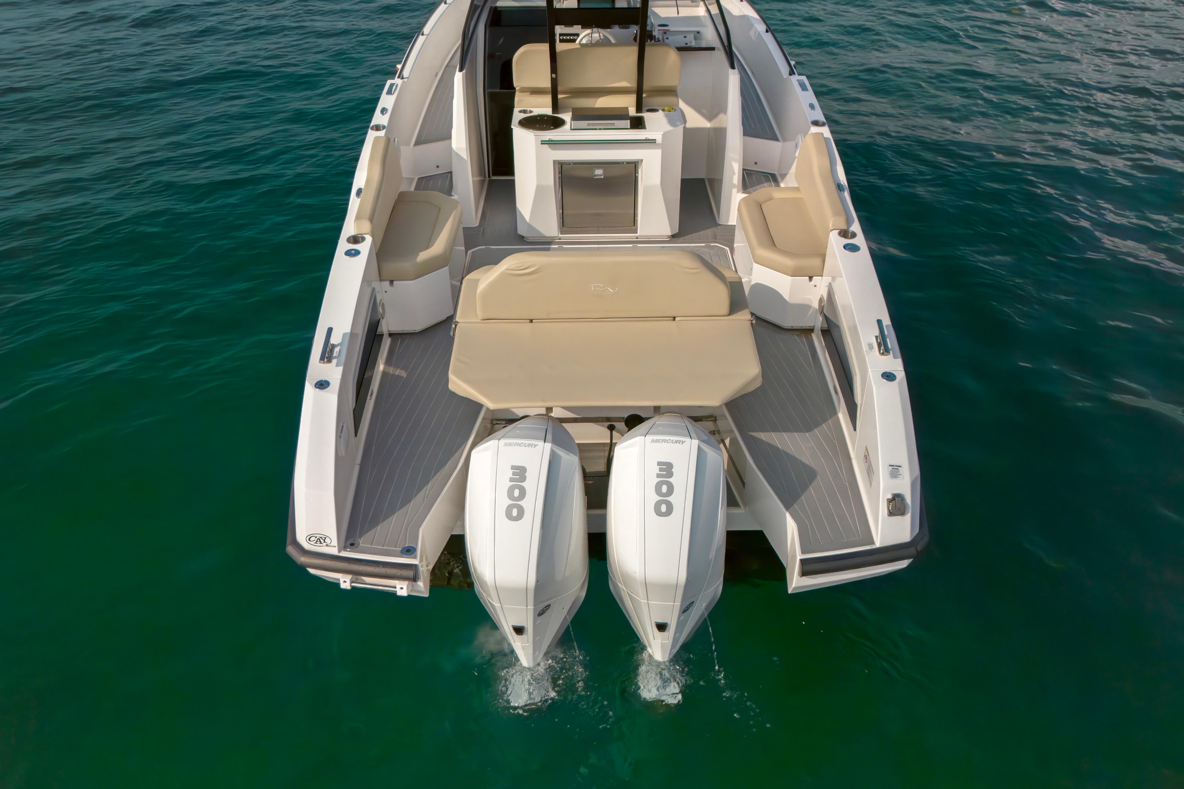 2023 Rio Yachts Daytona 34 with dual engines on clear water.