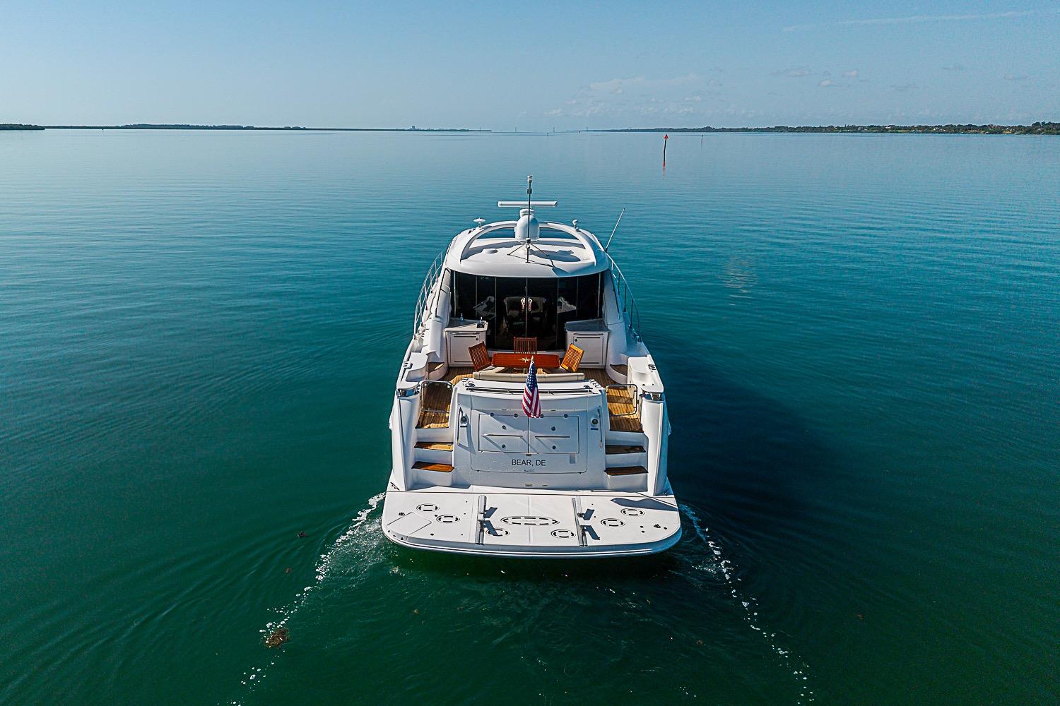 2008 Sea Ray 60 Sundancer yacht cruising on calm blue waters.