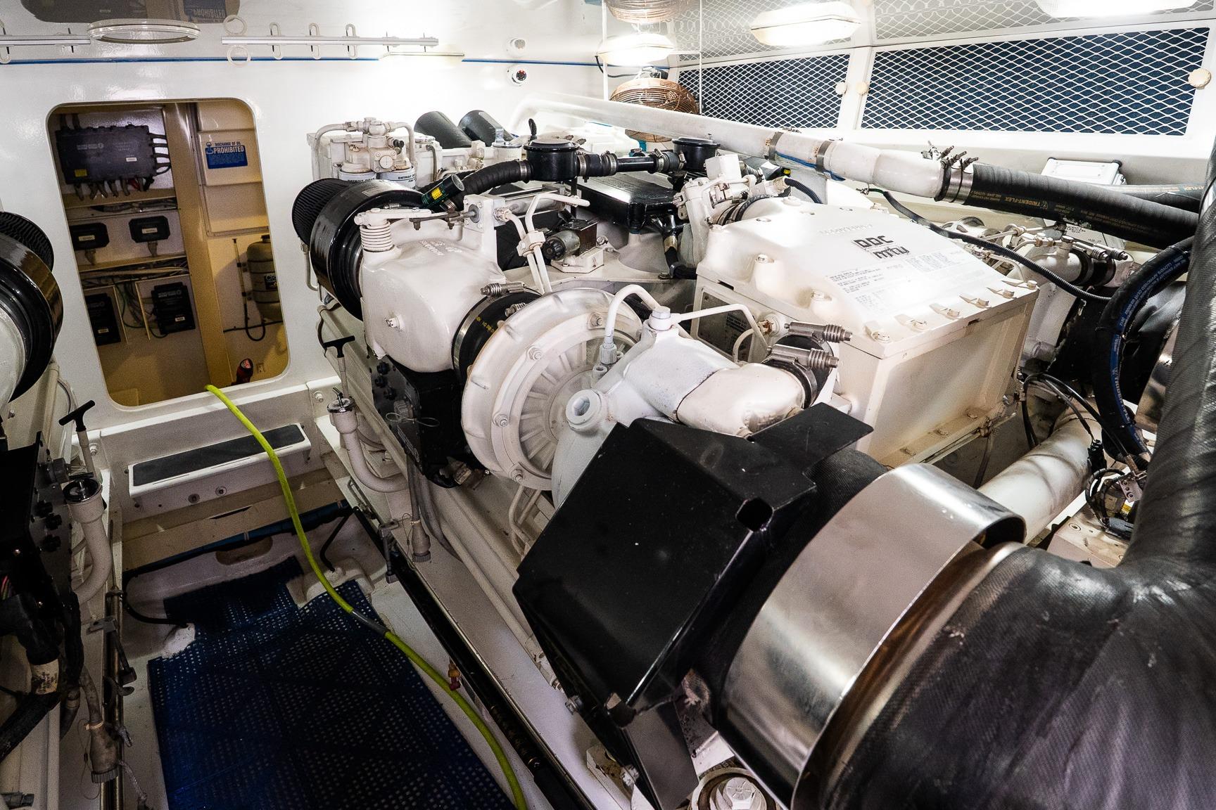 Engine room of 2002 Viking 61 Enclosed Bridge yacht, featuring advanced machinery and equipment.