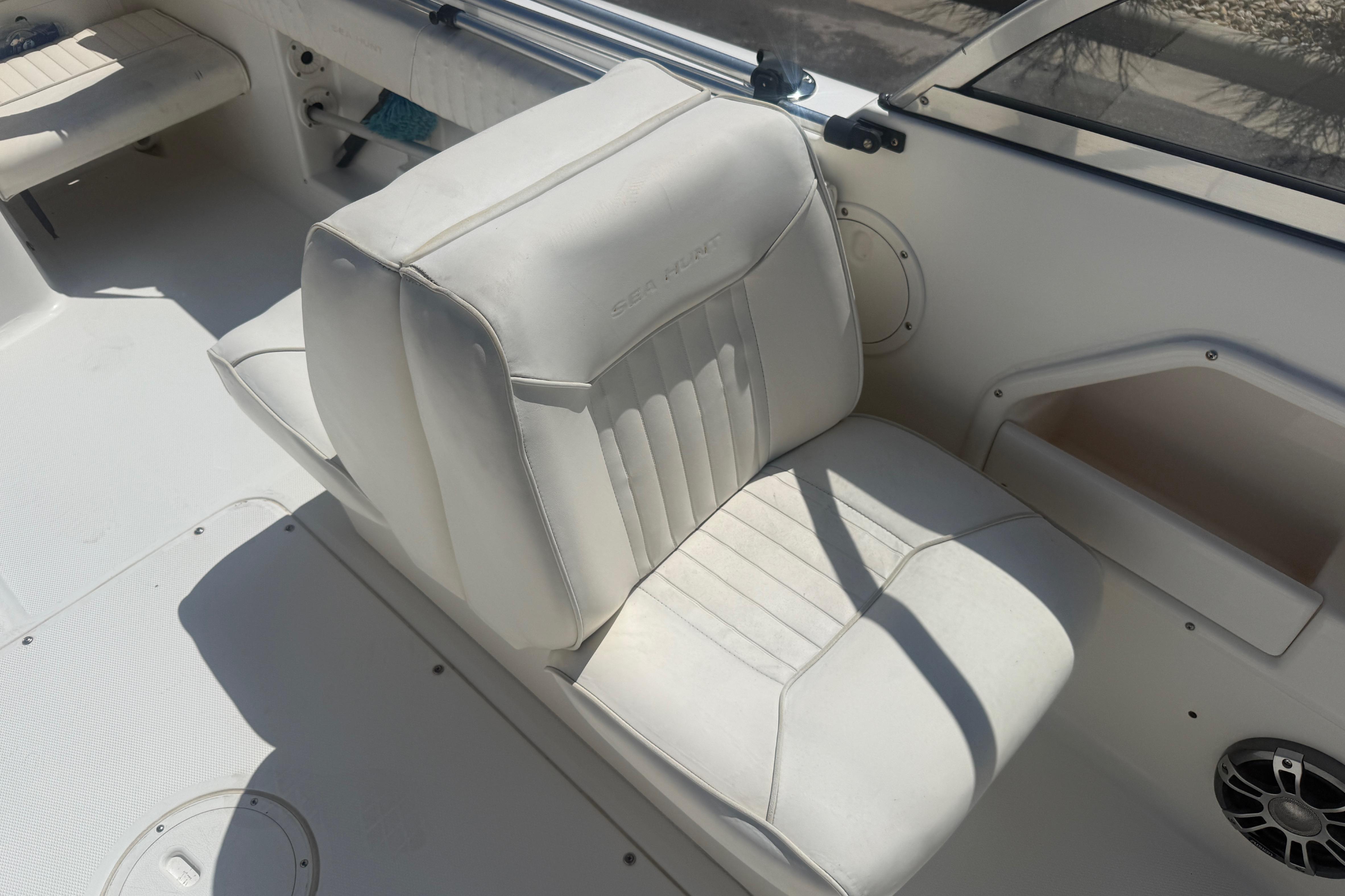 White seating on a 2006 Sea Hunt Escape 200 boat, featuring clean upholstery.