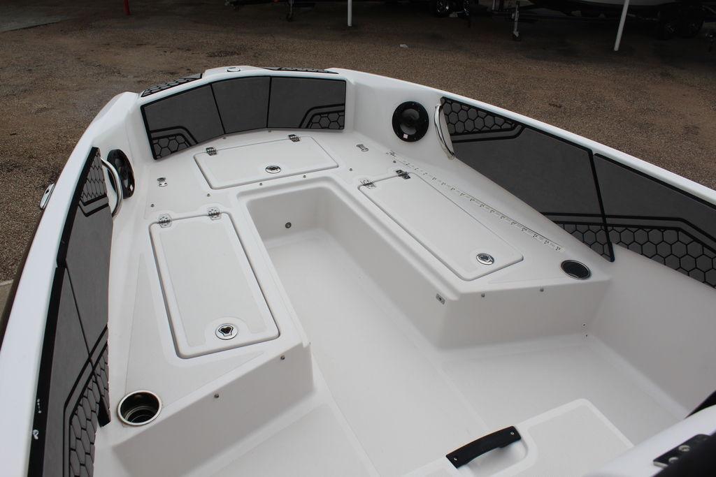 Interior view of a 2017 Scarab 195 boat, featuring spacious seating and storage compartments.