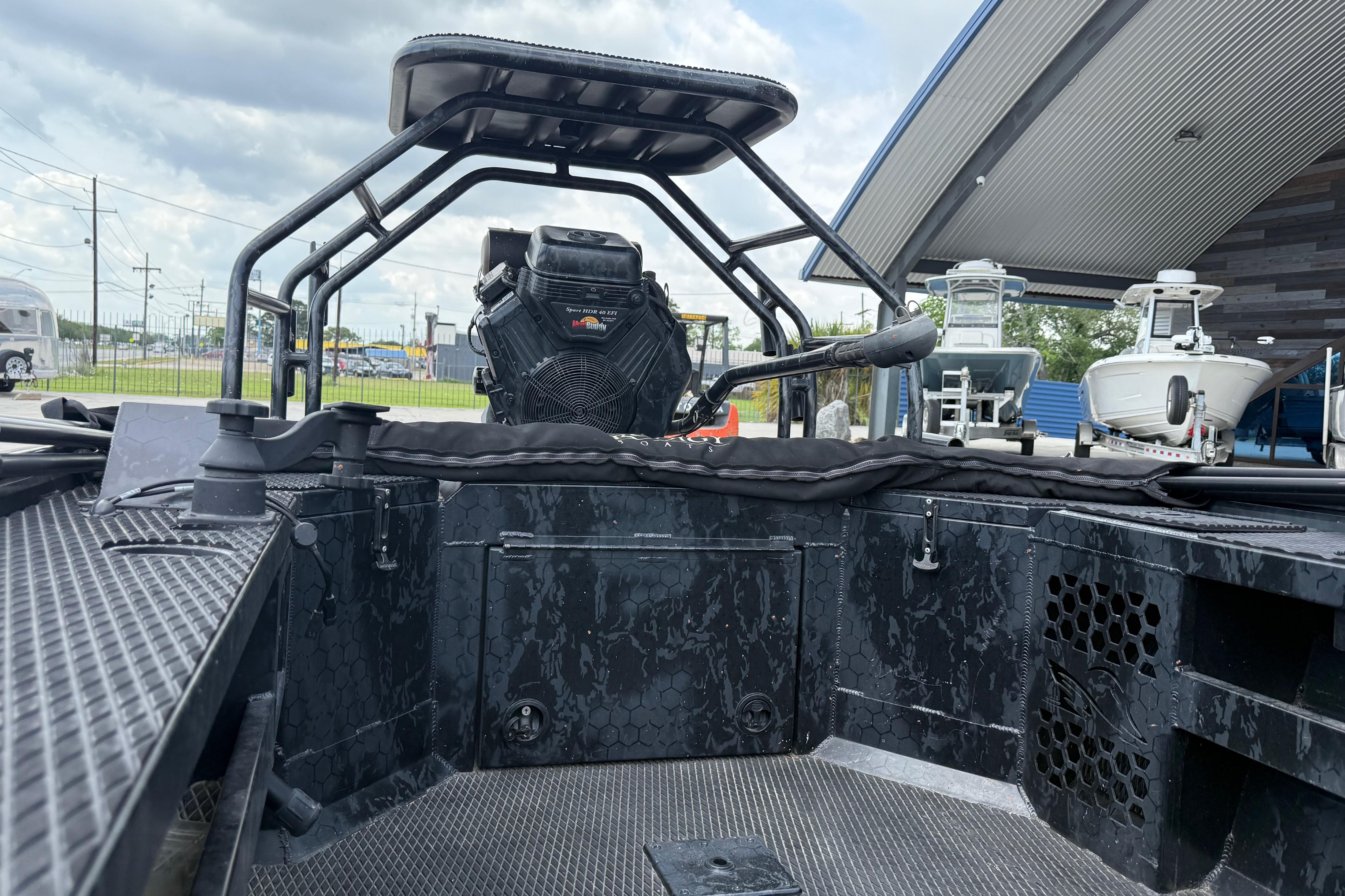 2024 Prodigy 17 boat interior with steering and seating, displayed outdoors.