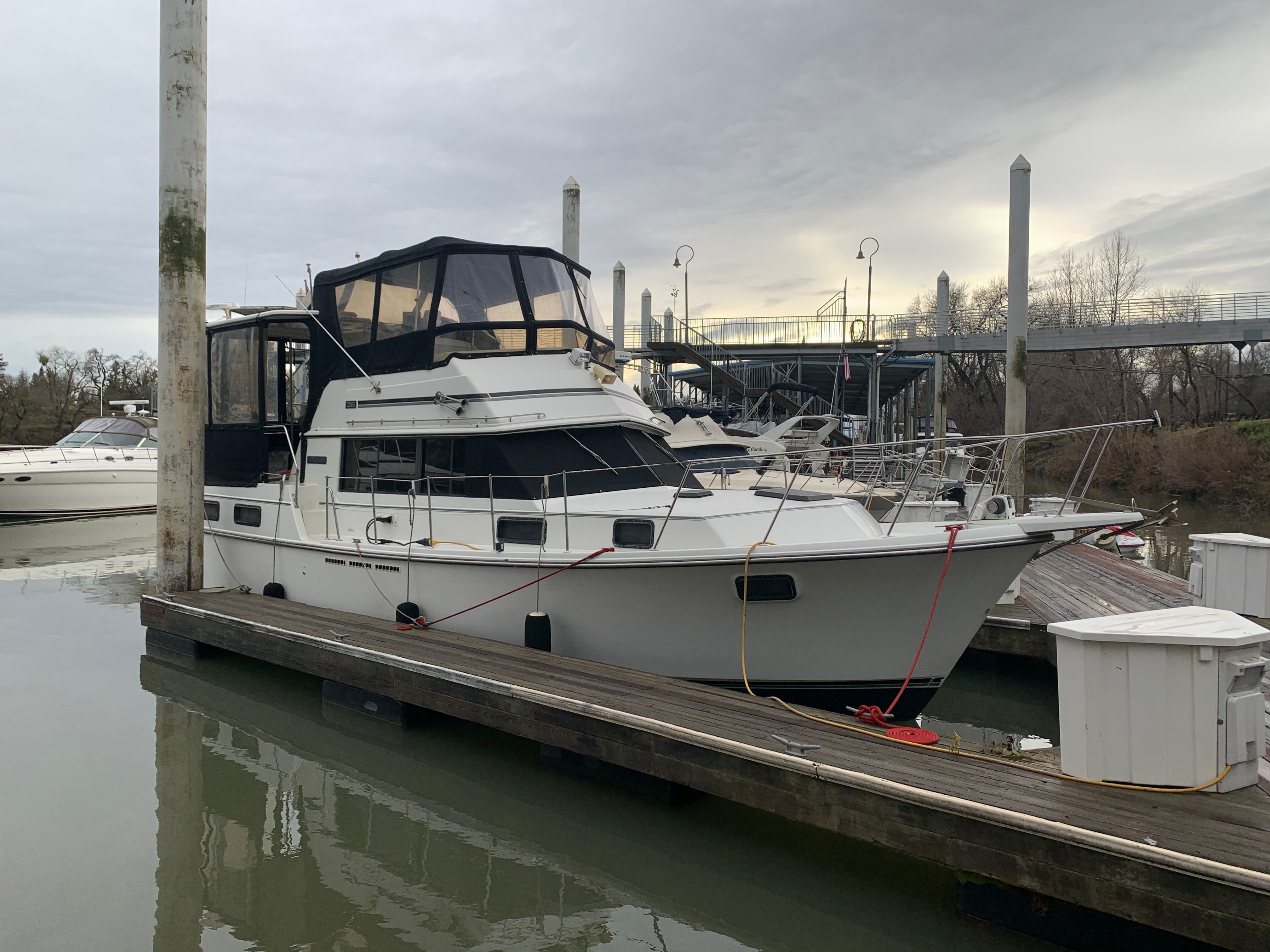 1988 Carver 3607 Aft Cabin Motor Yacht docked at a marina.