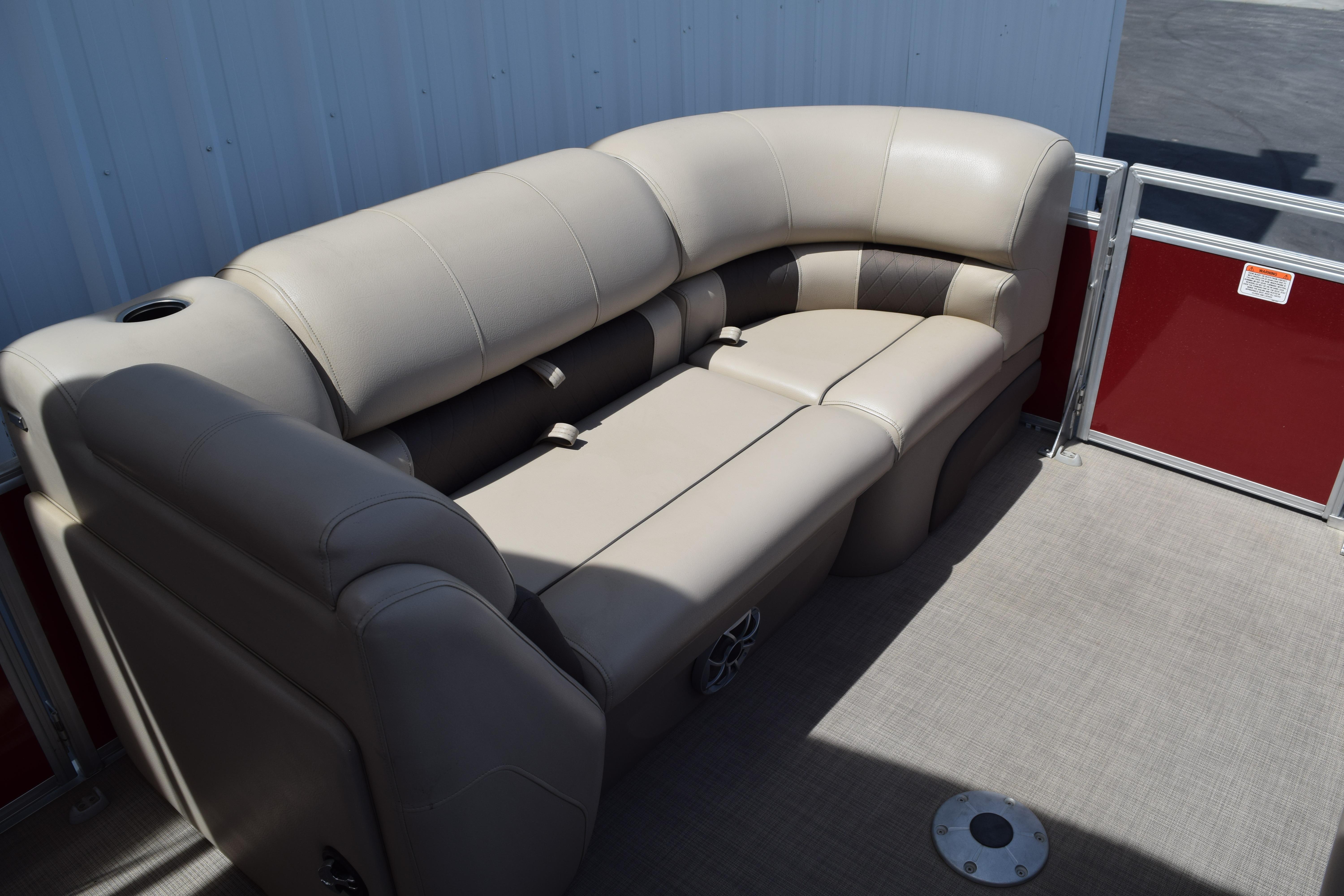 2025 Sun Tracker Party Barge 22 XP3, beige seating, spacious deck, red paneling.