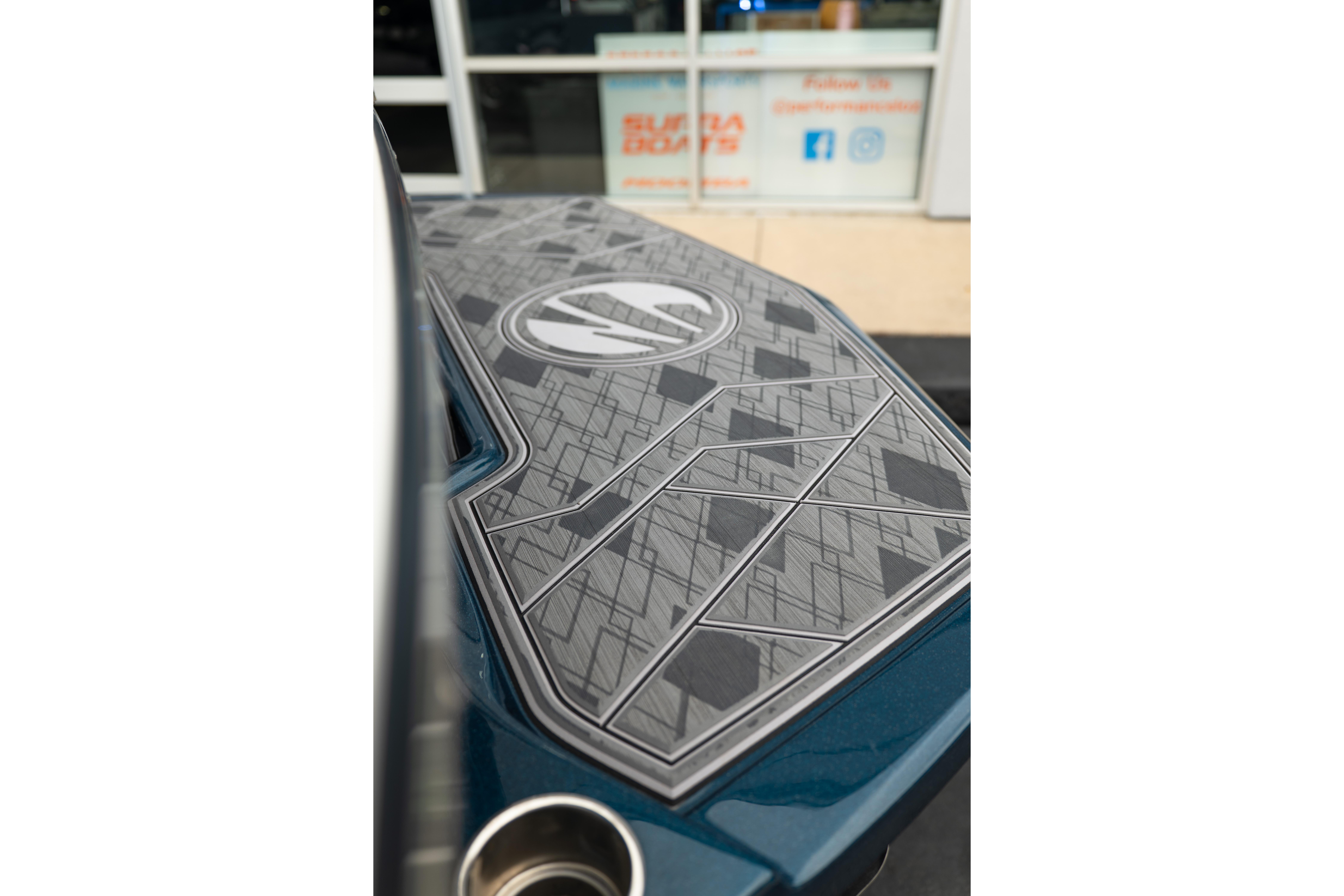 2024 Tigé Z5 boat deck with geometric pattern and logo detail.