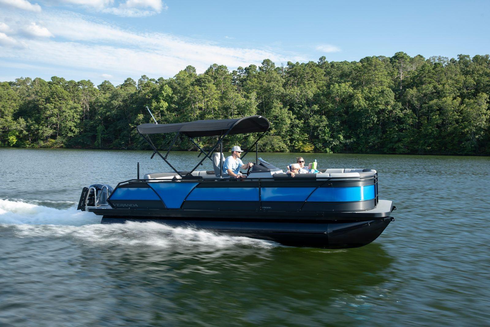 2026 Veranda VR235L pontoon boat cruising on a scenic lake.