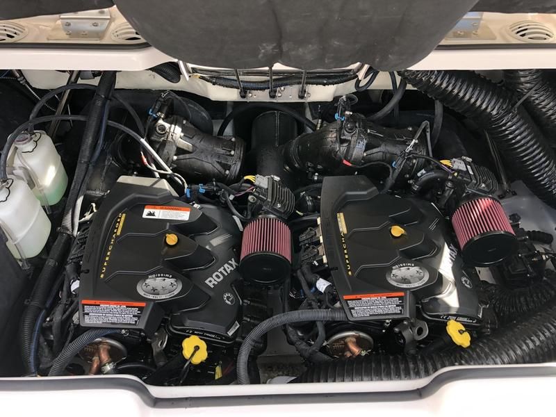 Two Rotax engines in the engine compartment of a 2018 Scarab 255 HOI.
