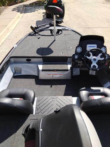2025 Tahoe T21 boat interior with steering wheel and seating.