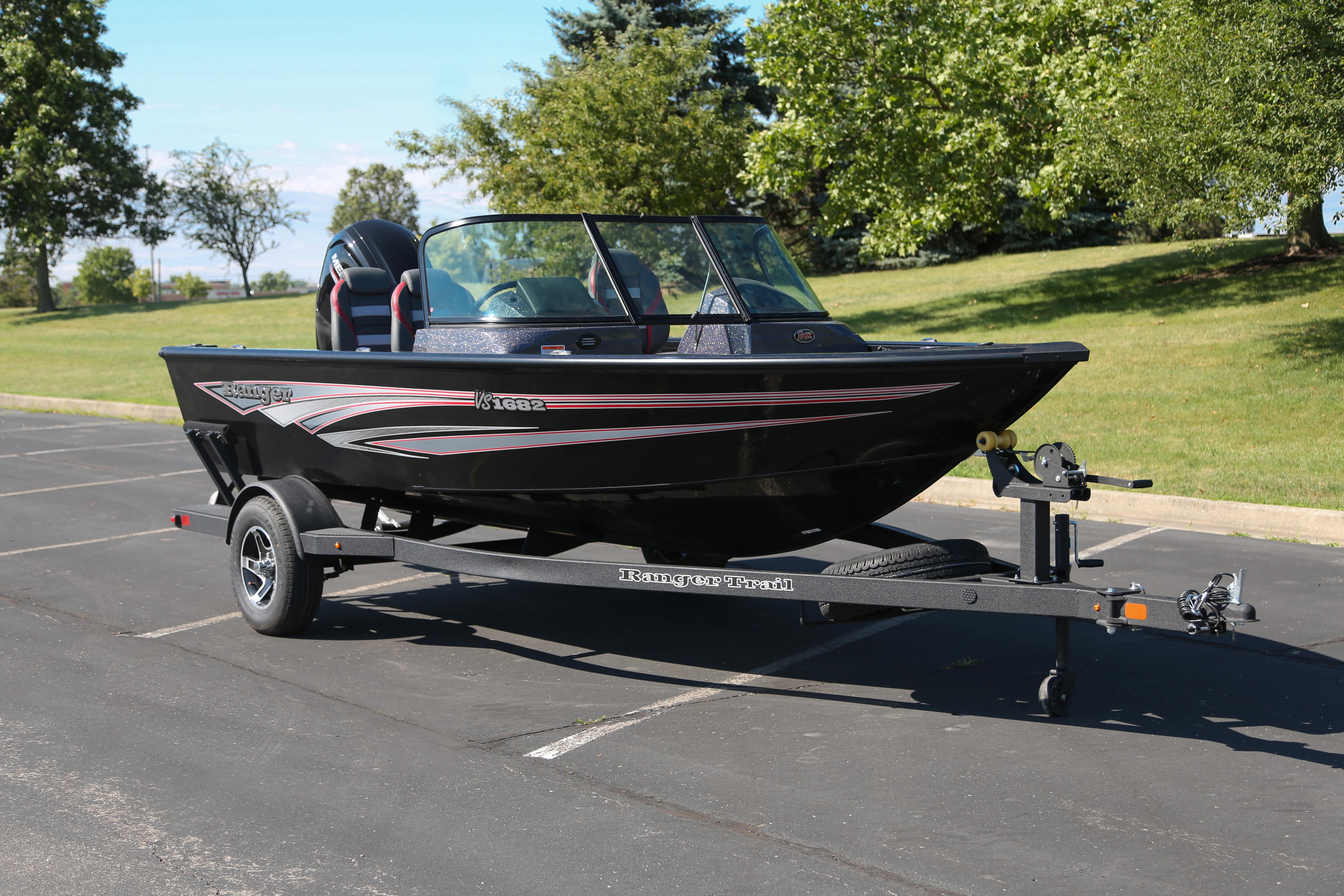2026 Ranger VS1682SC Angler boat on trailer in sunny parking lot.