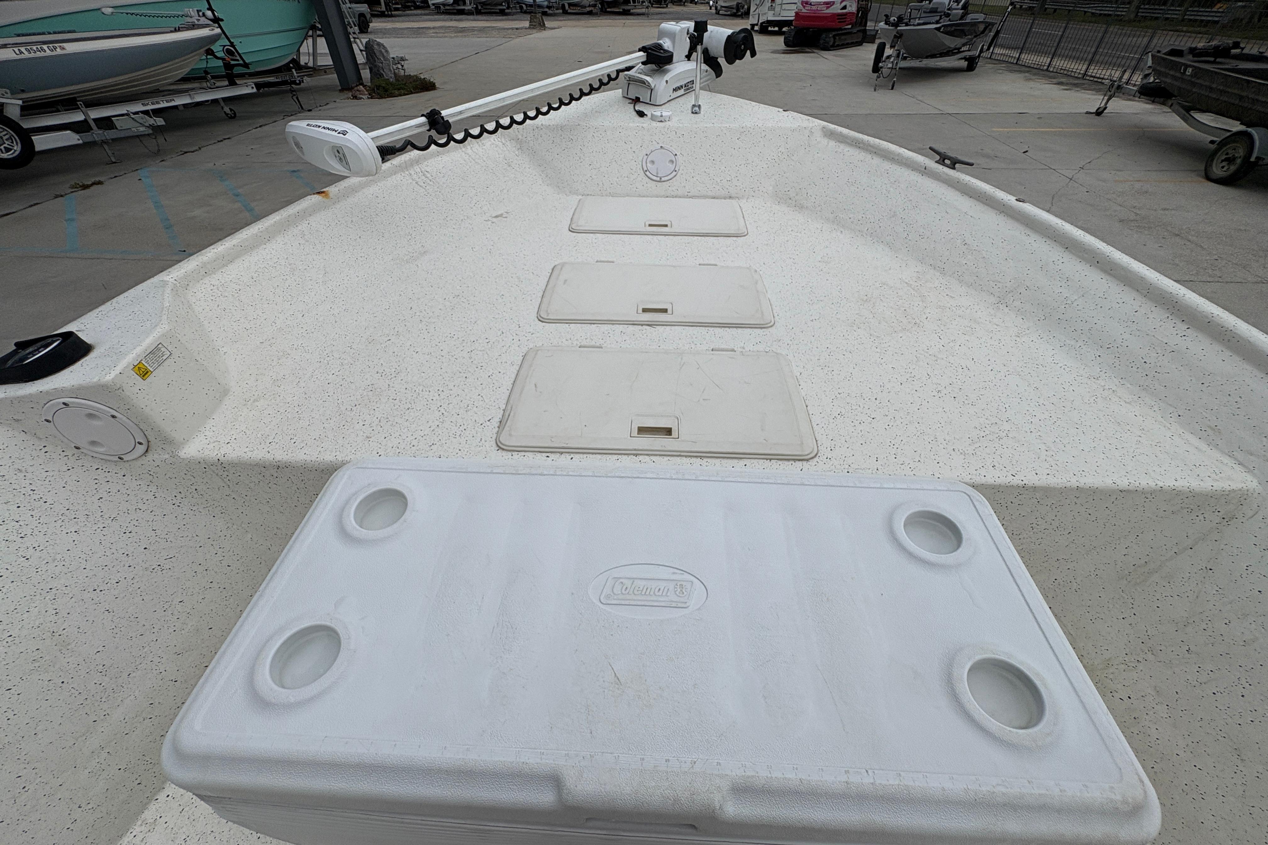 1998 Hydra-Sports 22 Ocean CC boat deck with storage compartments and cooler.