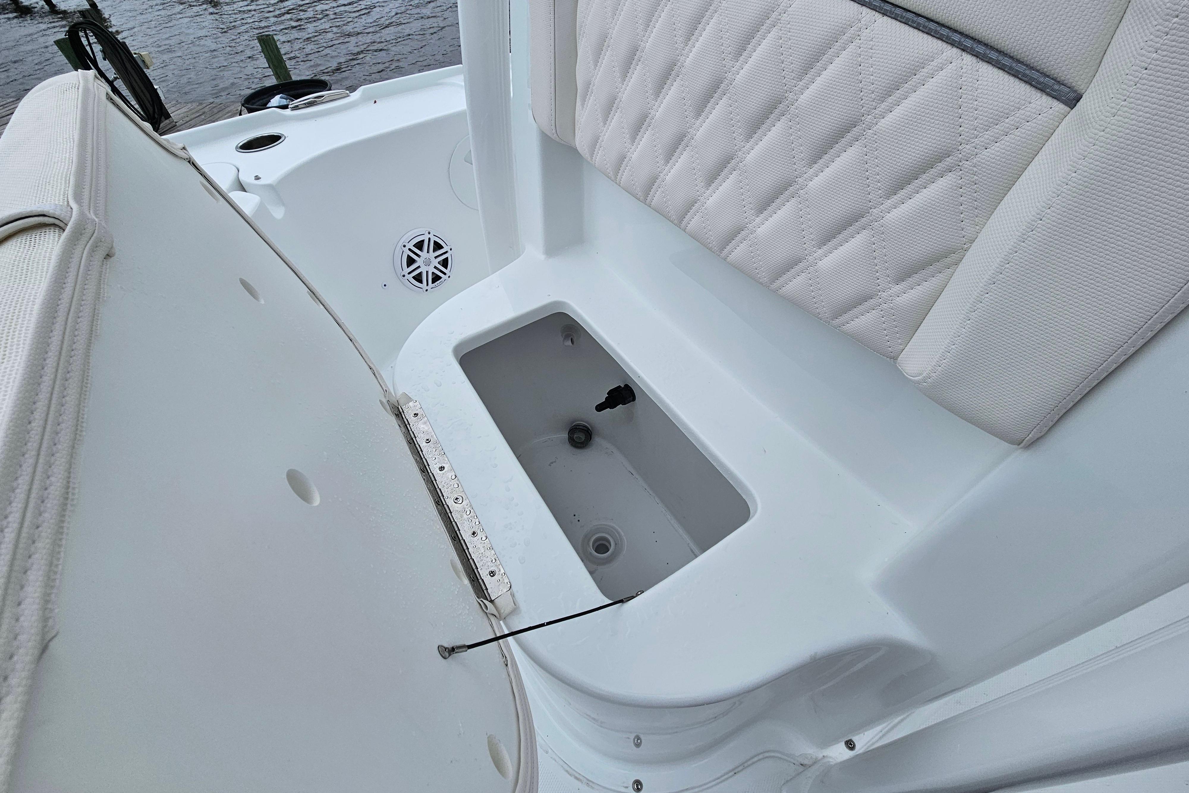2026 Sea Hunt BX 22 BR boat interior with cushioned seating and storage compartment.