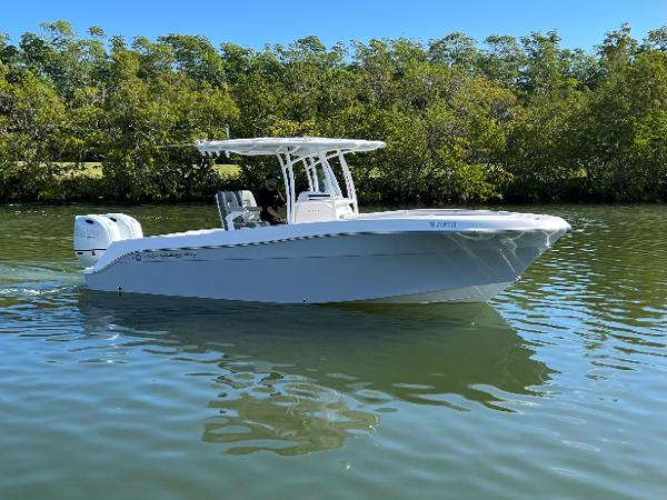 2022 Aquasport 2500 Center Console on calm water.