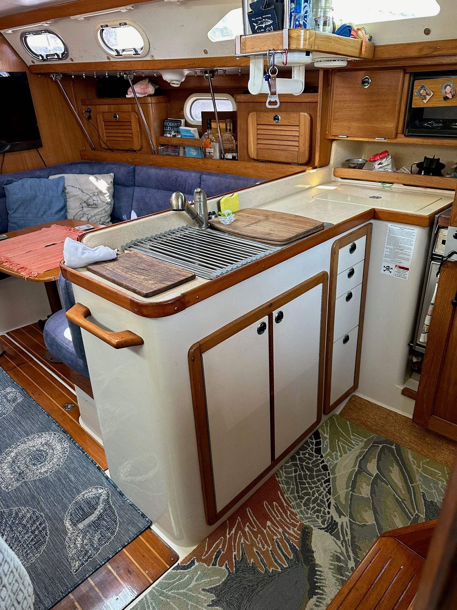 Interior of a Catalina MkII yacht with a kitchen and seating area.