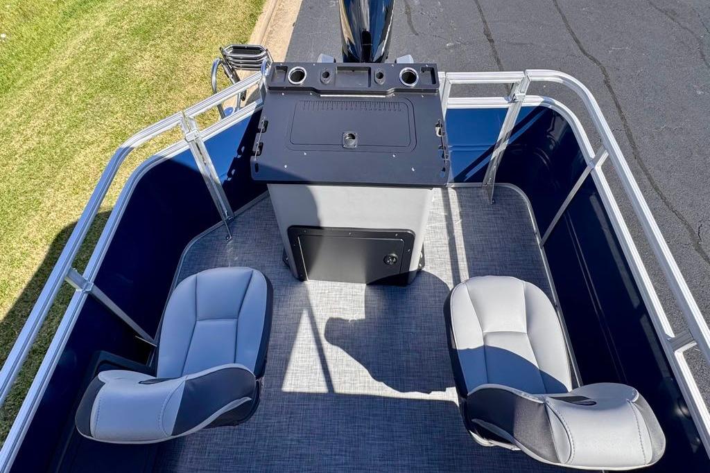 2026 Sun Tracker Sportfish 24 XP3 boat interior with seating and control console.