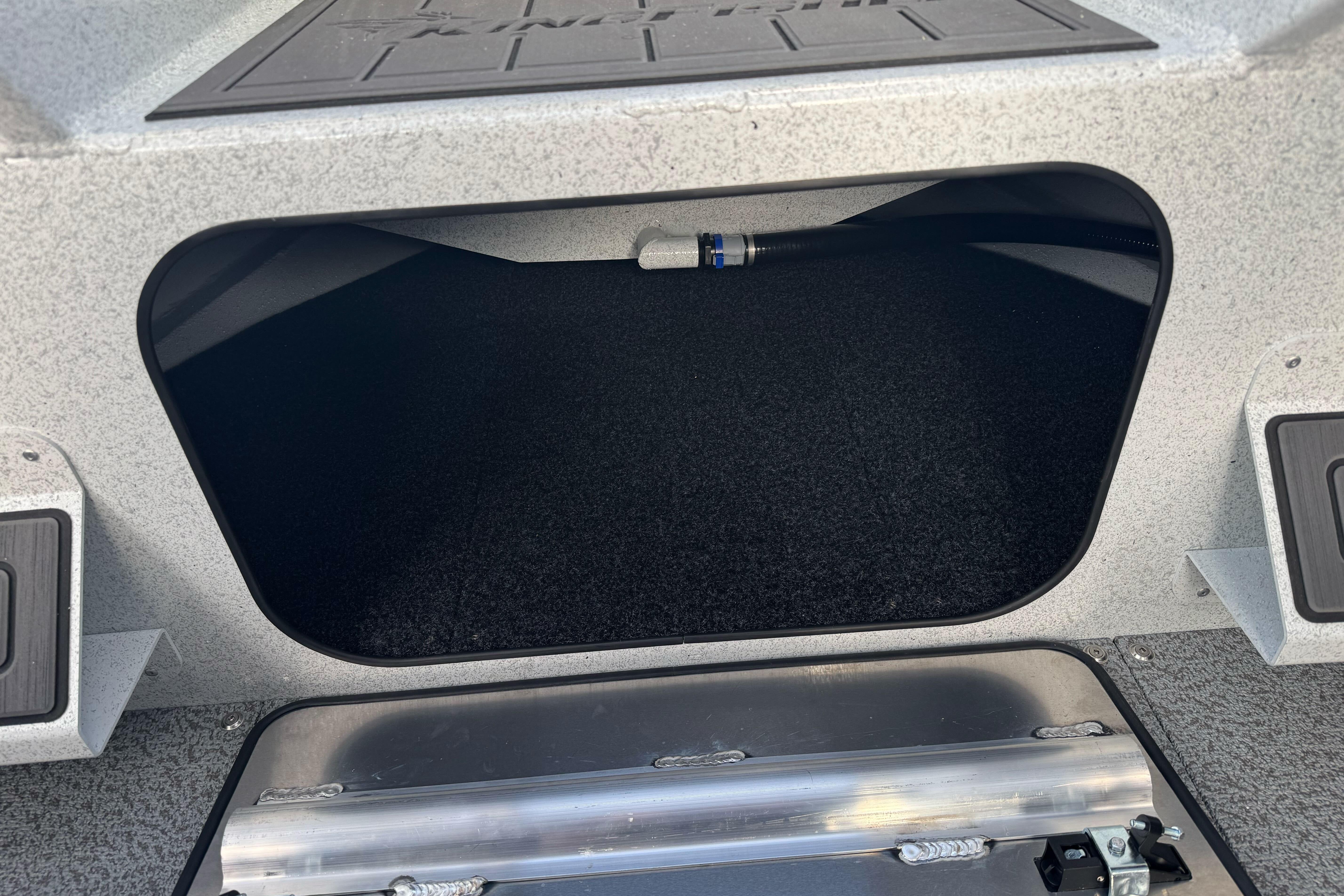 Storage compartment of 2026 KingFisher 2025 Escape boat, featuring durable interior design.