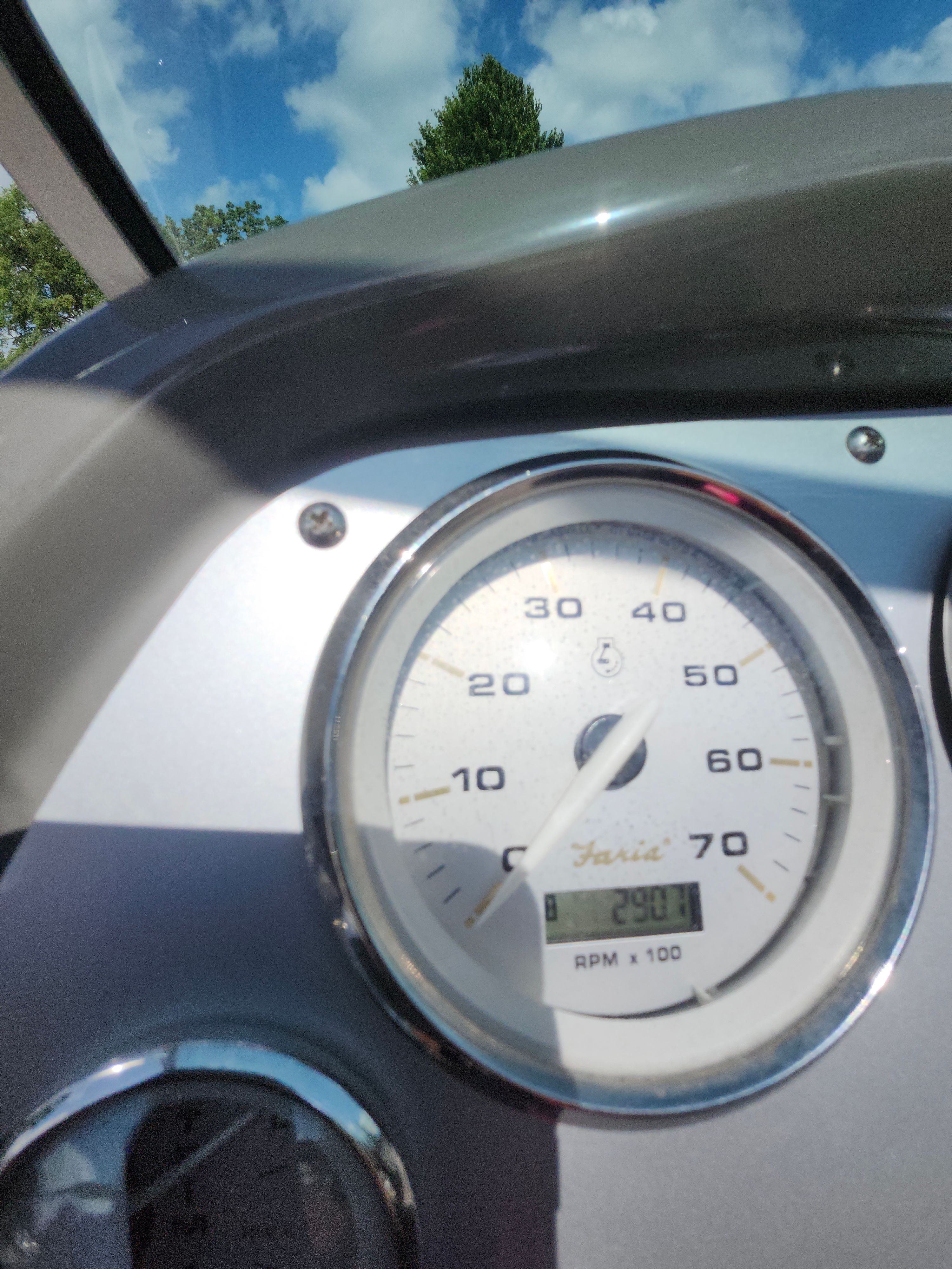 Close-up of a boat's tachometer showing 29.0 hours.