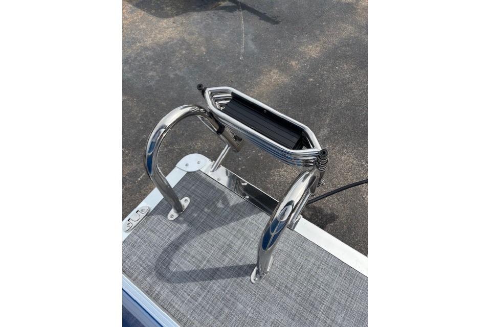 Stainless steel ladder on 2026 Sun Tracker Party Barge 16 DLX pontoon boat.