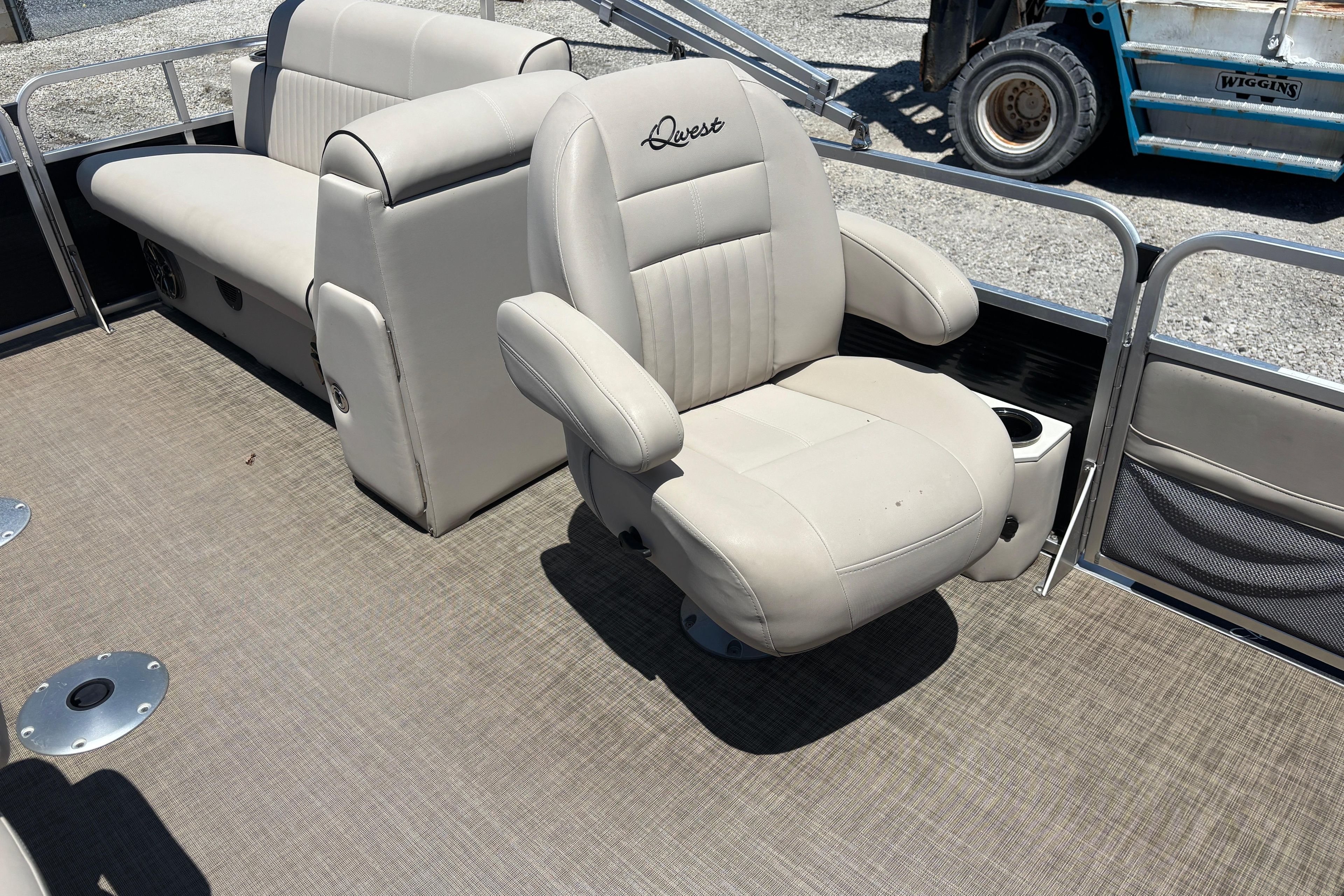 2017 Qwest LS 822 Bar boat interior with beige seating and carpeted floor.
