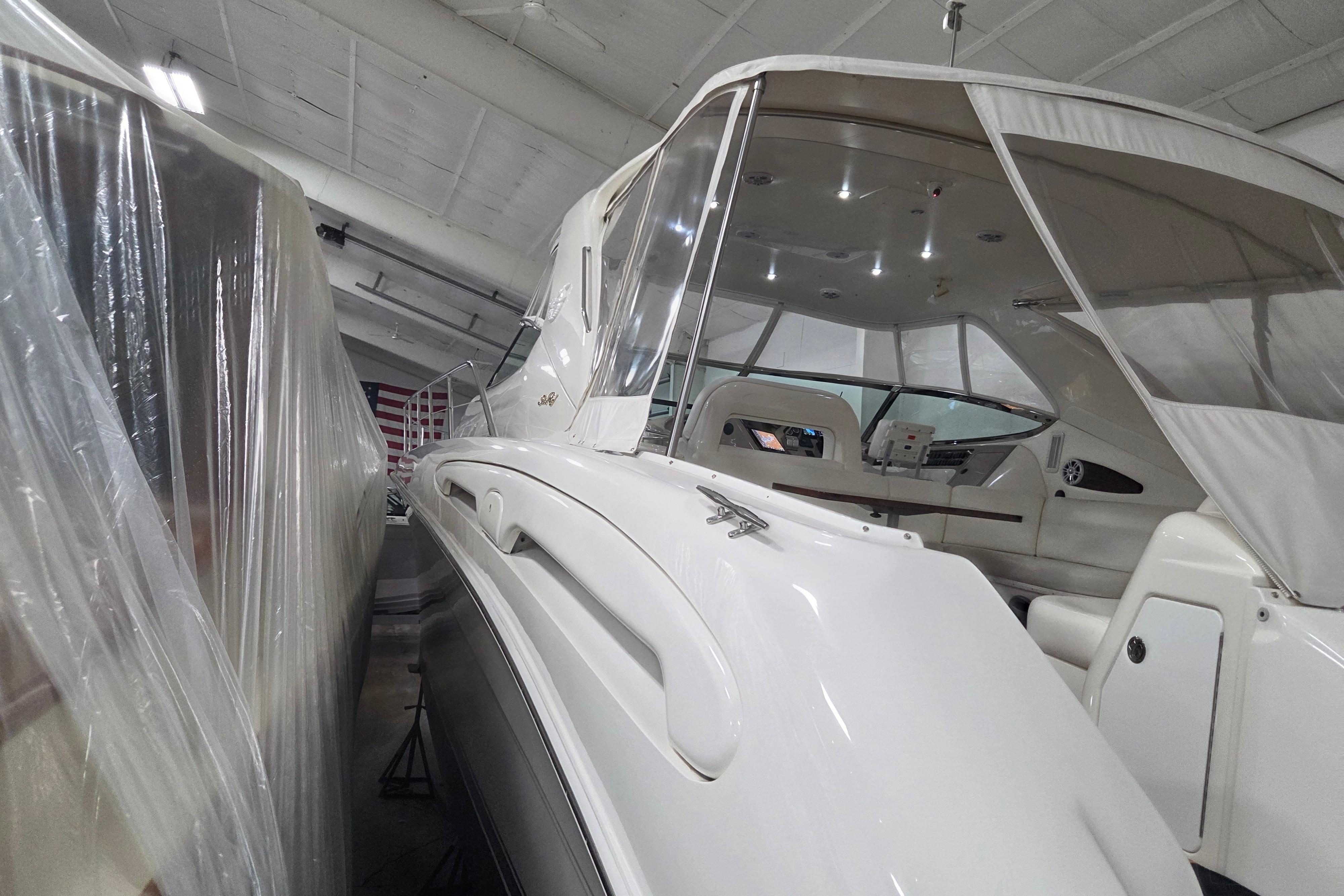 2000 Sea Ray Sundancer 540 yacht in storage, covered and well-maintained indoors.
