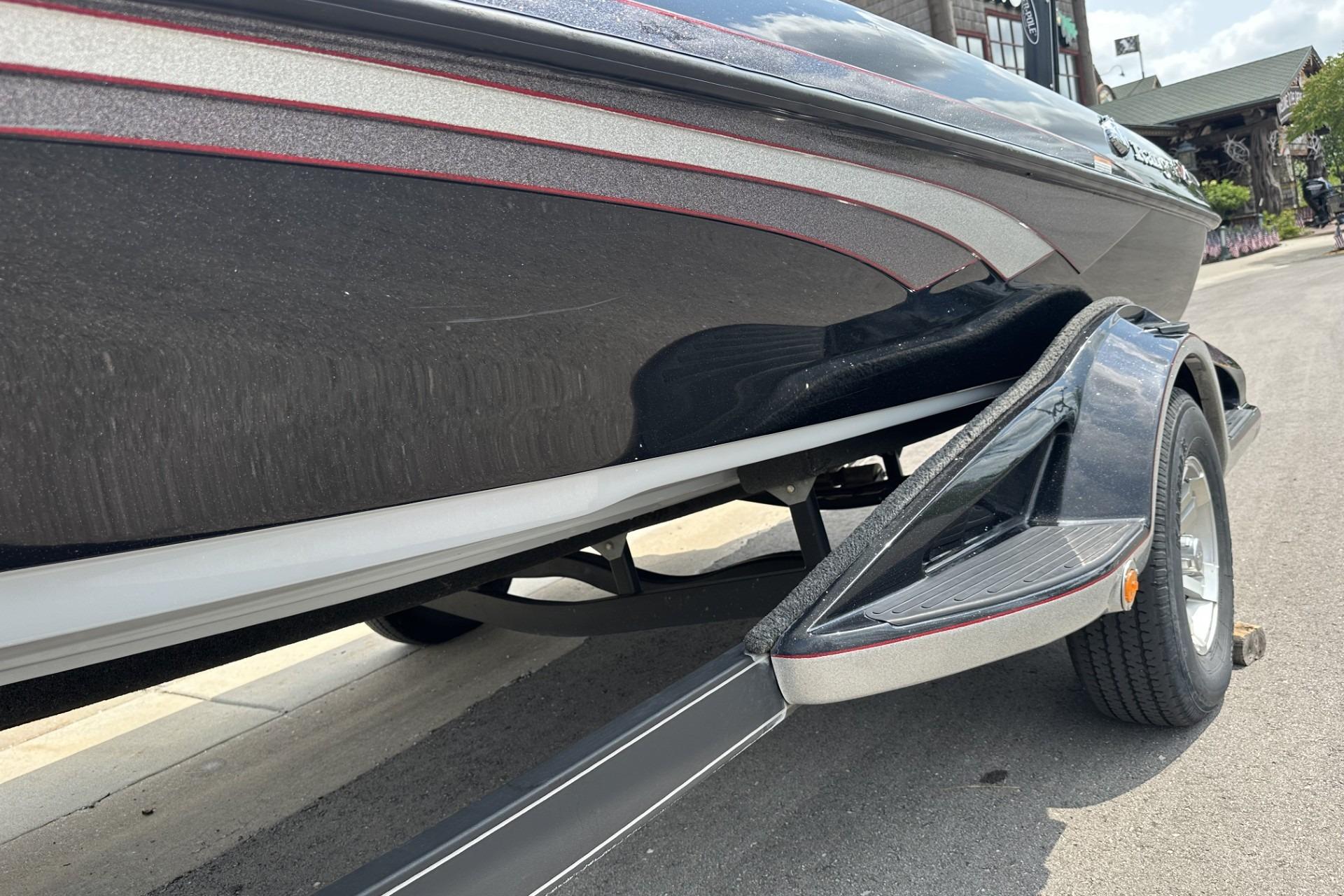 2018 Ranger Z518 boat on trailer, showcasing sleek black and silver design.