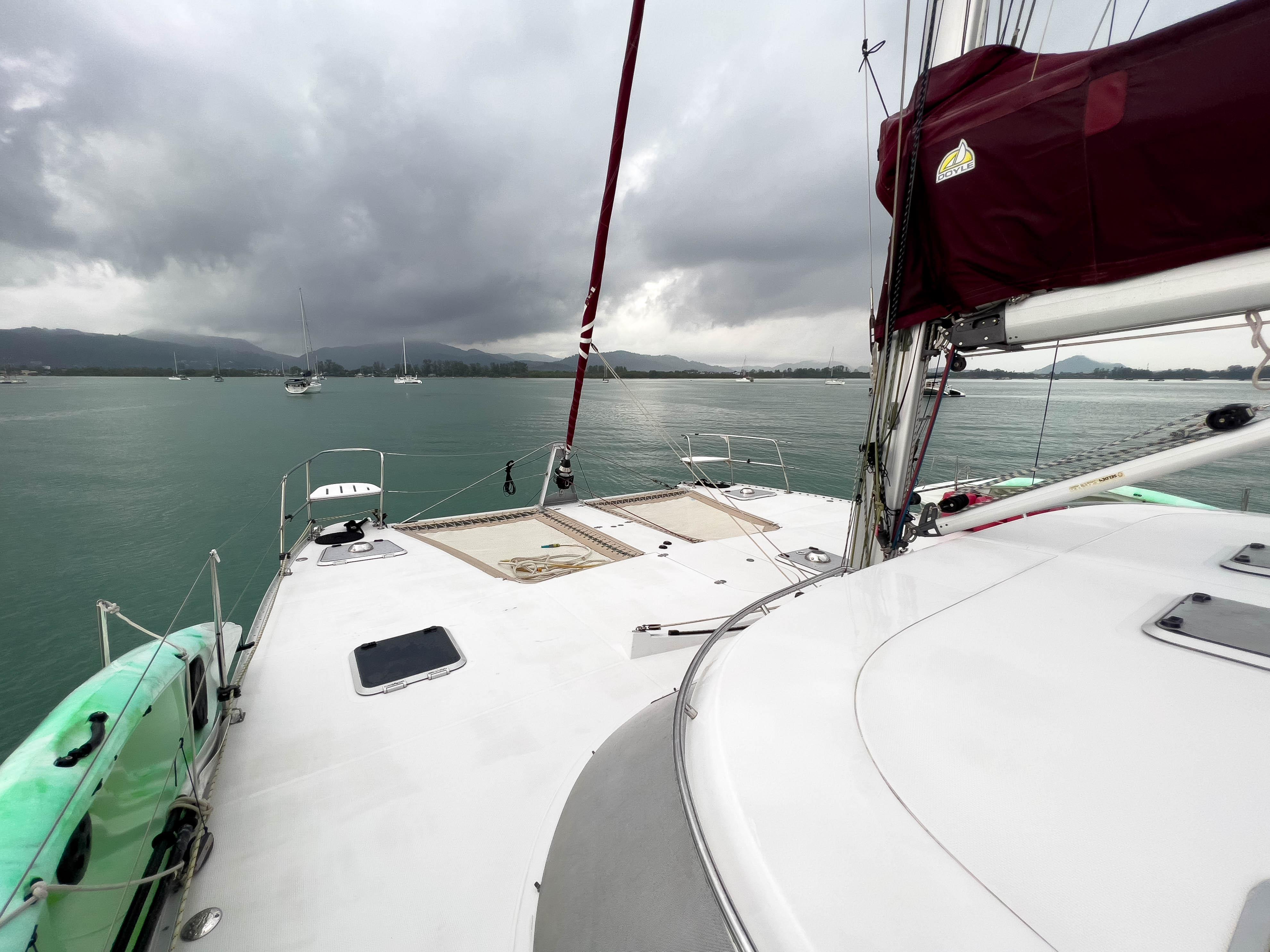 Sailing yacht Antares PDQ 44, 2005 model, on calm waters under cloudy skies.