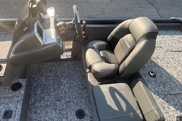 2026 Tracker Pro Team 195 boat interior with gray seating and steering console.
