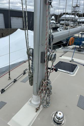 1983 O'Day 39 sailboat deck with mast, ropes, and winches in a marina setting.