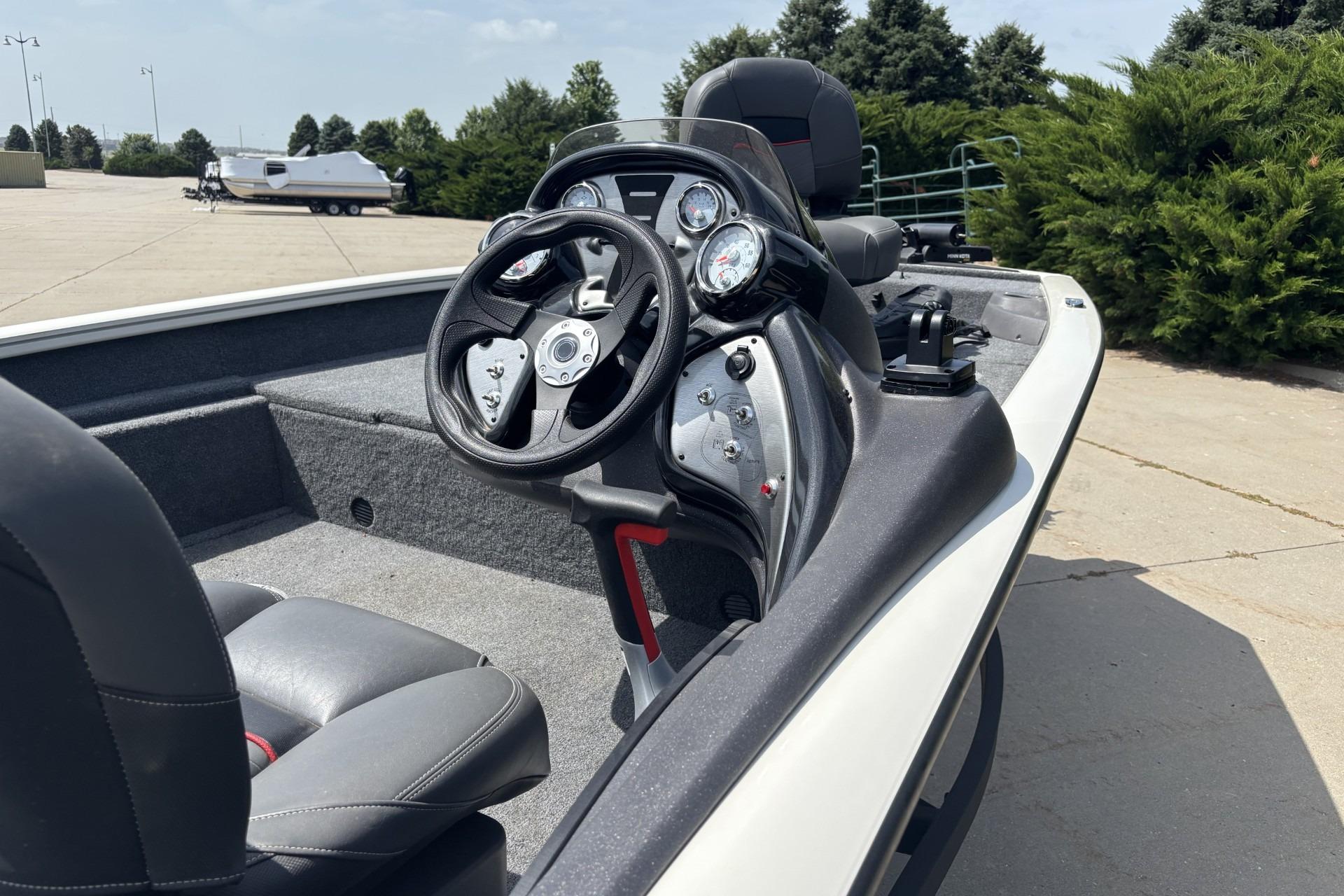 2024 Tracker Pro Team 175 TF boat interior with steering wheel and dashboard controls.