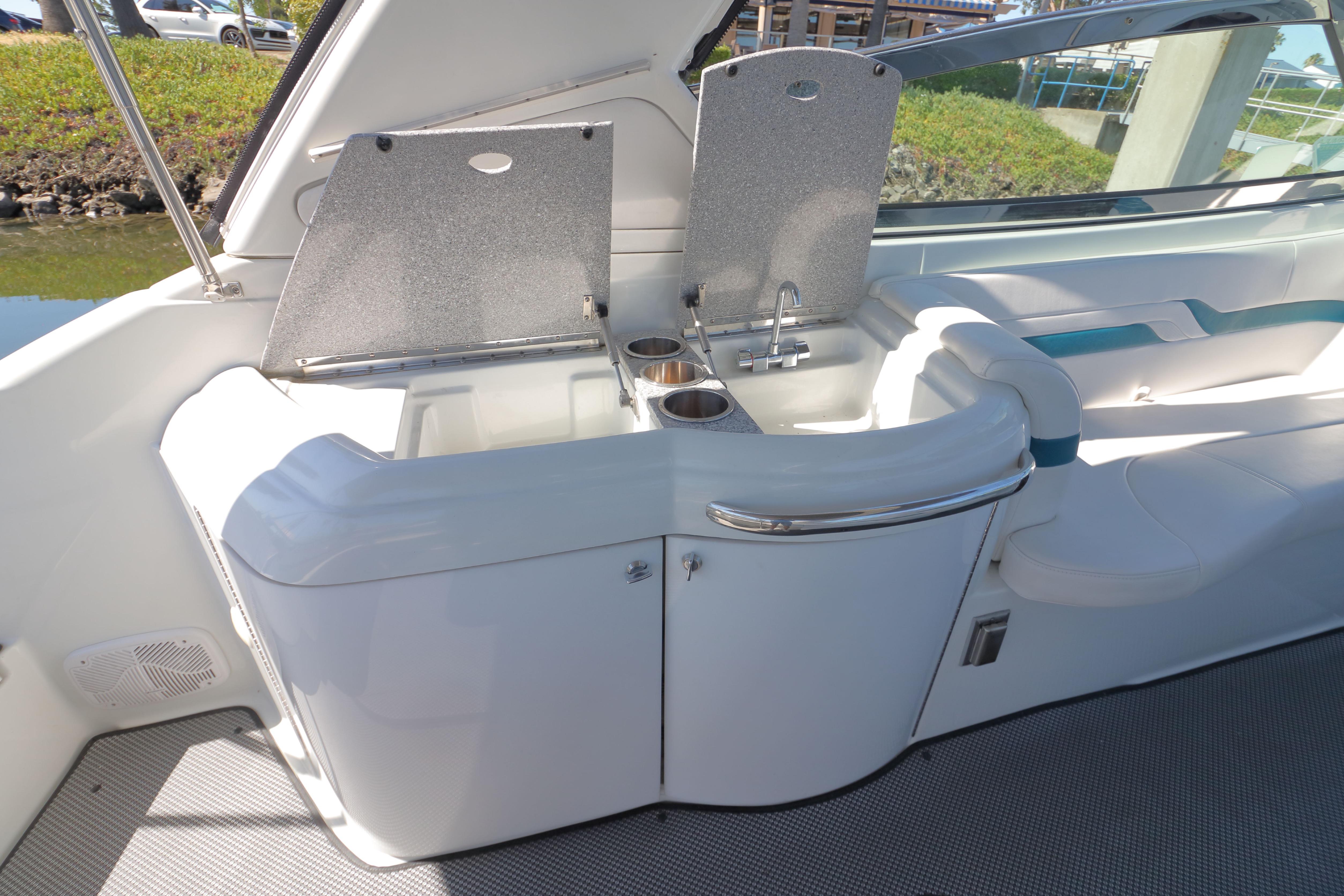 2006 Formula 330 Sun Sport boat interior with sink and seating area.