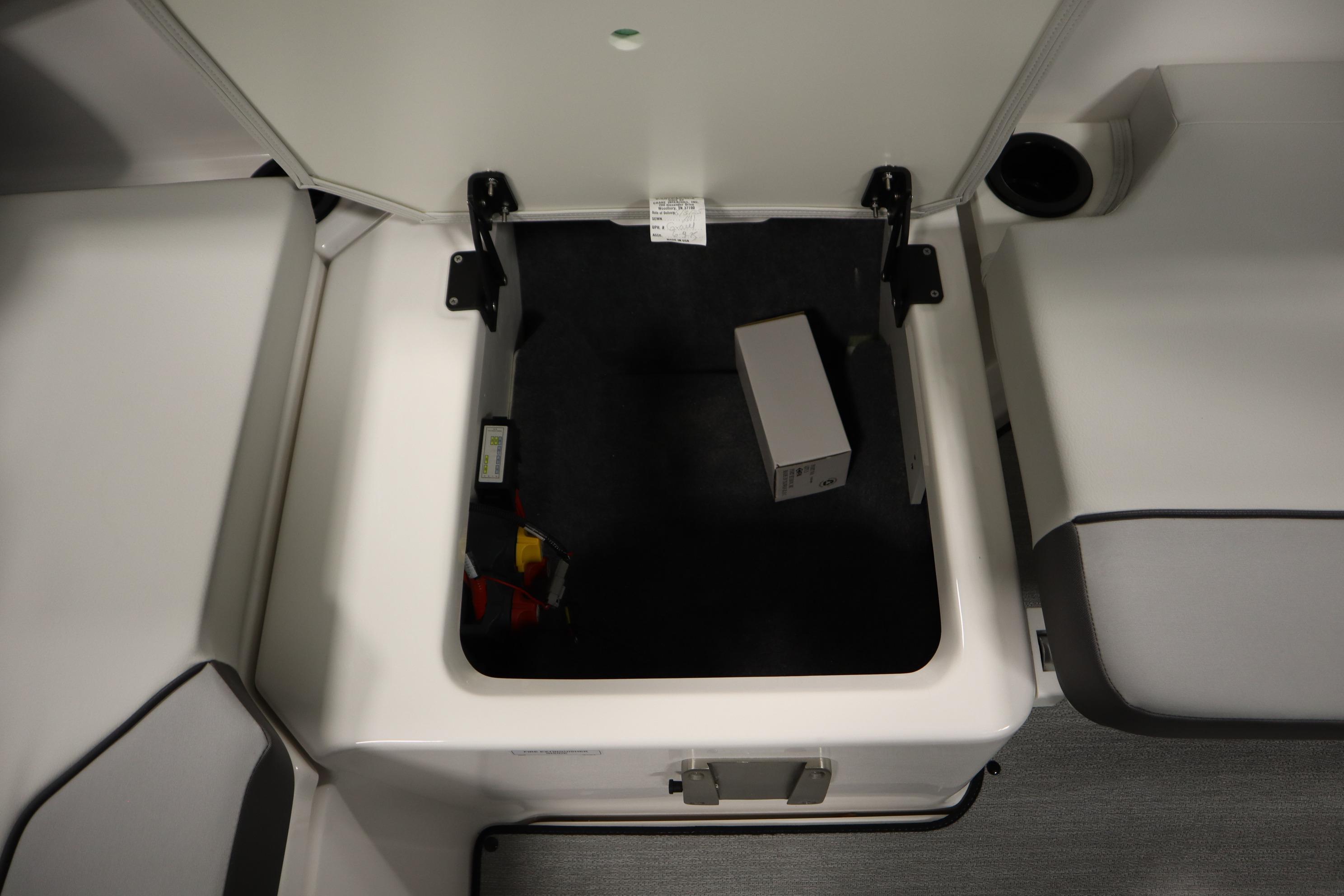 Storage compartment in 2026 Yamaha Boats AR220, featuring spacious interior and secure latch.