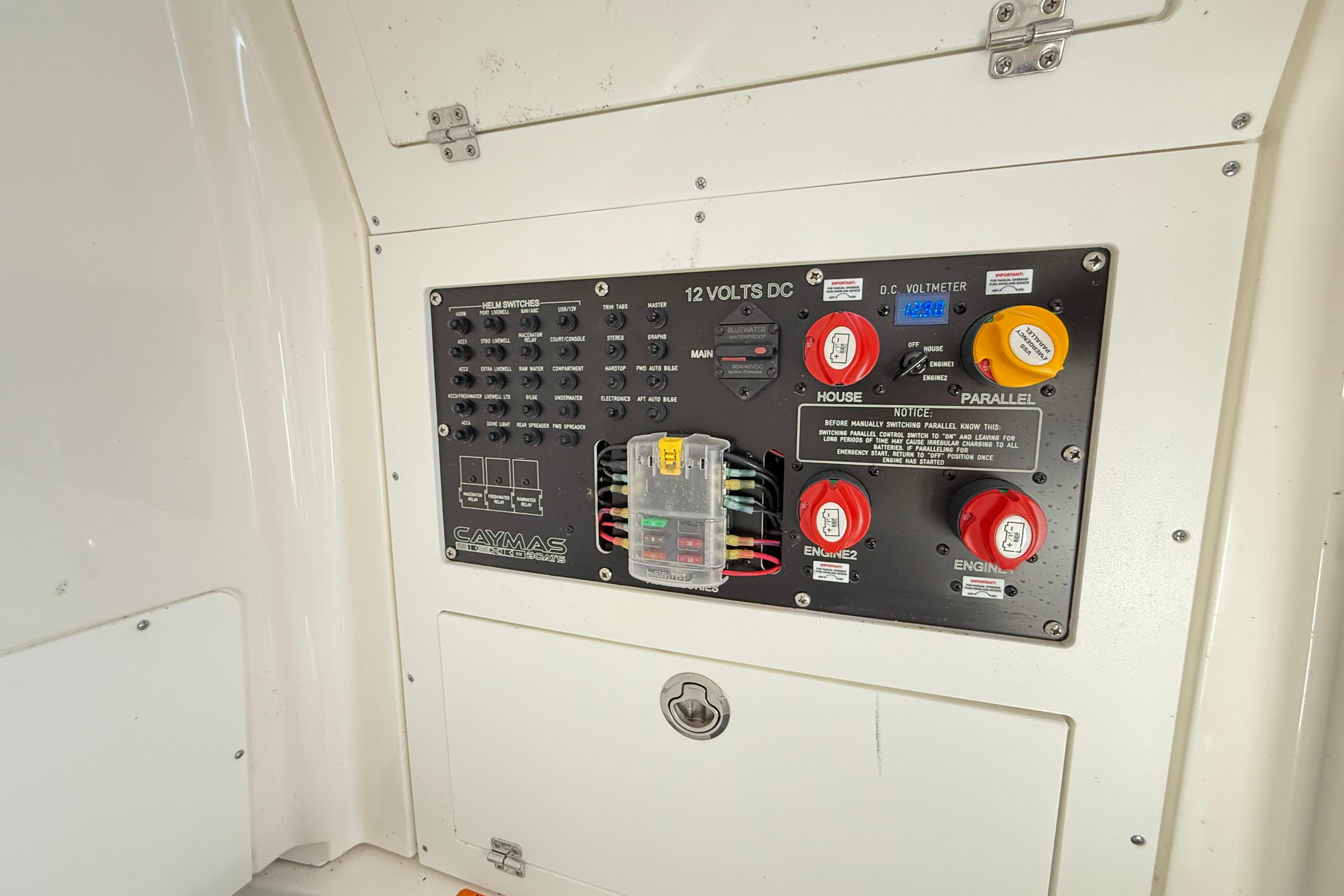Control panel of 2023 Caymas 281 HB boat with switches and voltmeter.