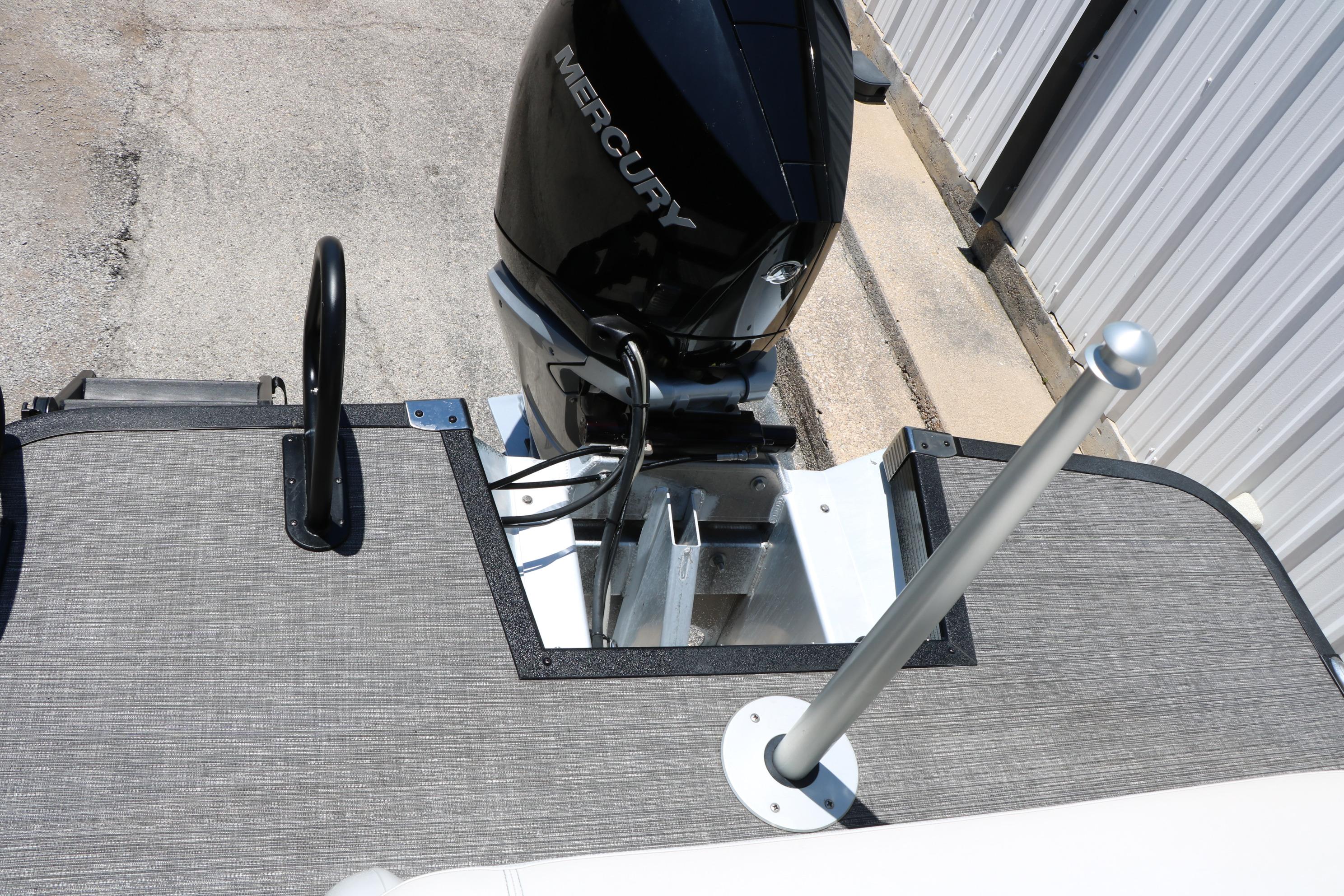 2024 Bennington 23 RX SWINGBACK boat with Mercury outboard motor, rear deck view.