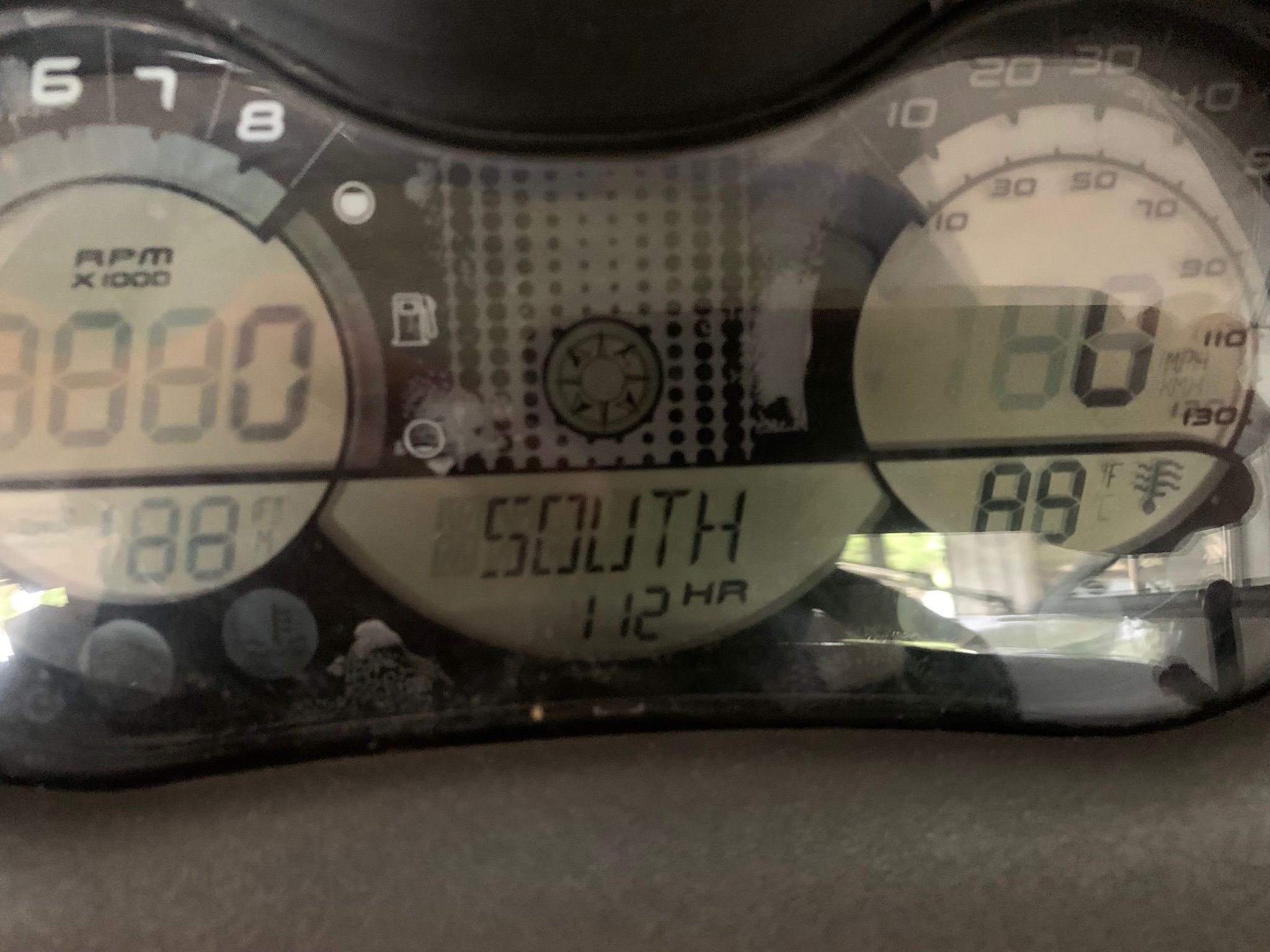 Dashboard of a 2008 Bombardier 180 Challenger with tachometer and compass.