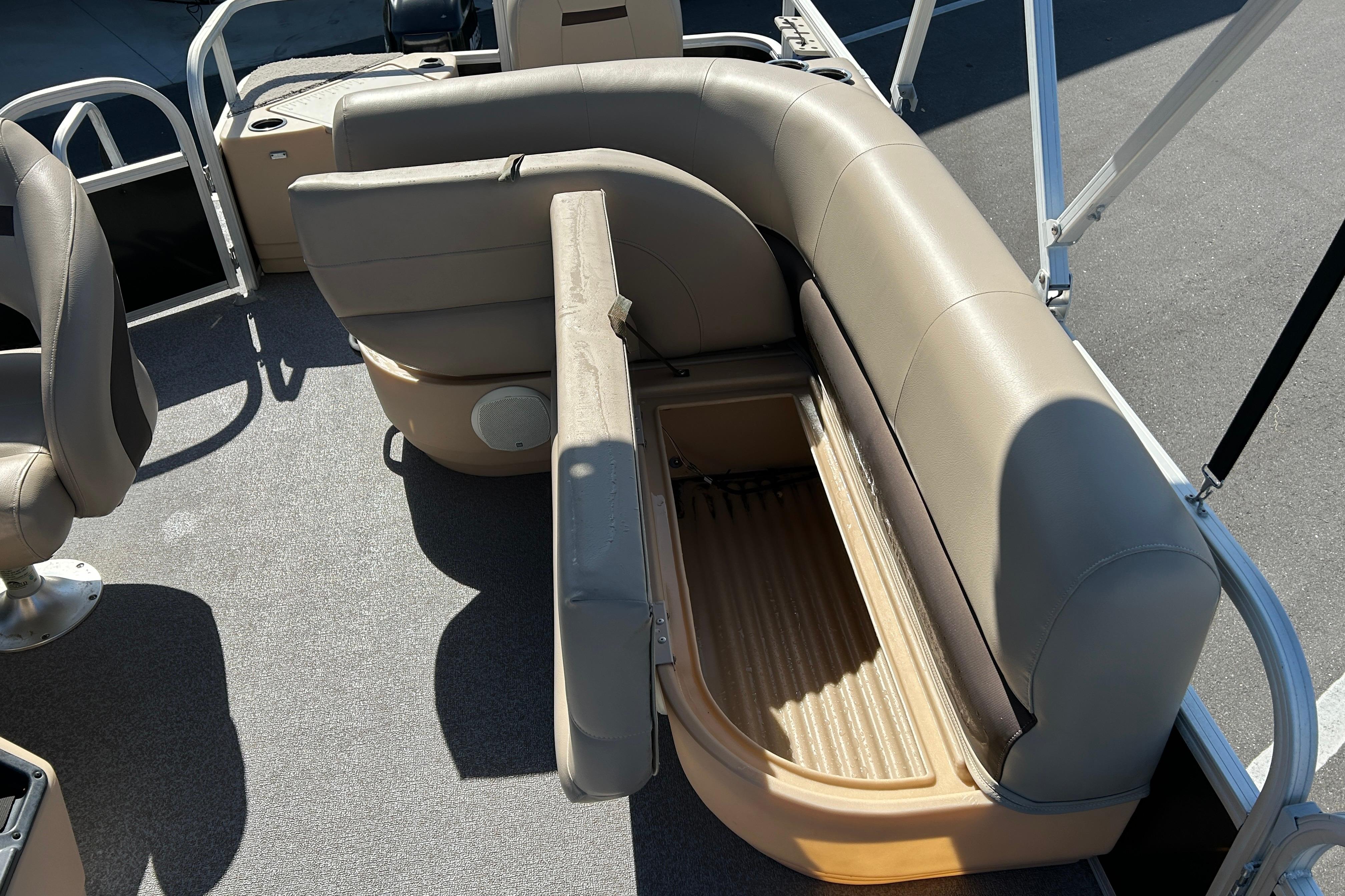 2017 Sun Tracker Bass Buggy 18 DLX pontoon boat interior with open storage compartment.