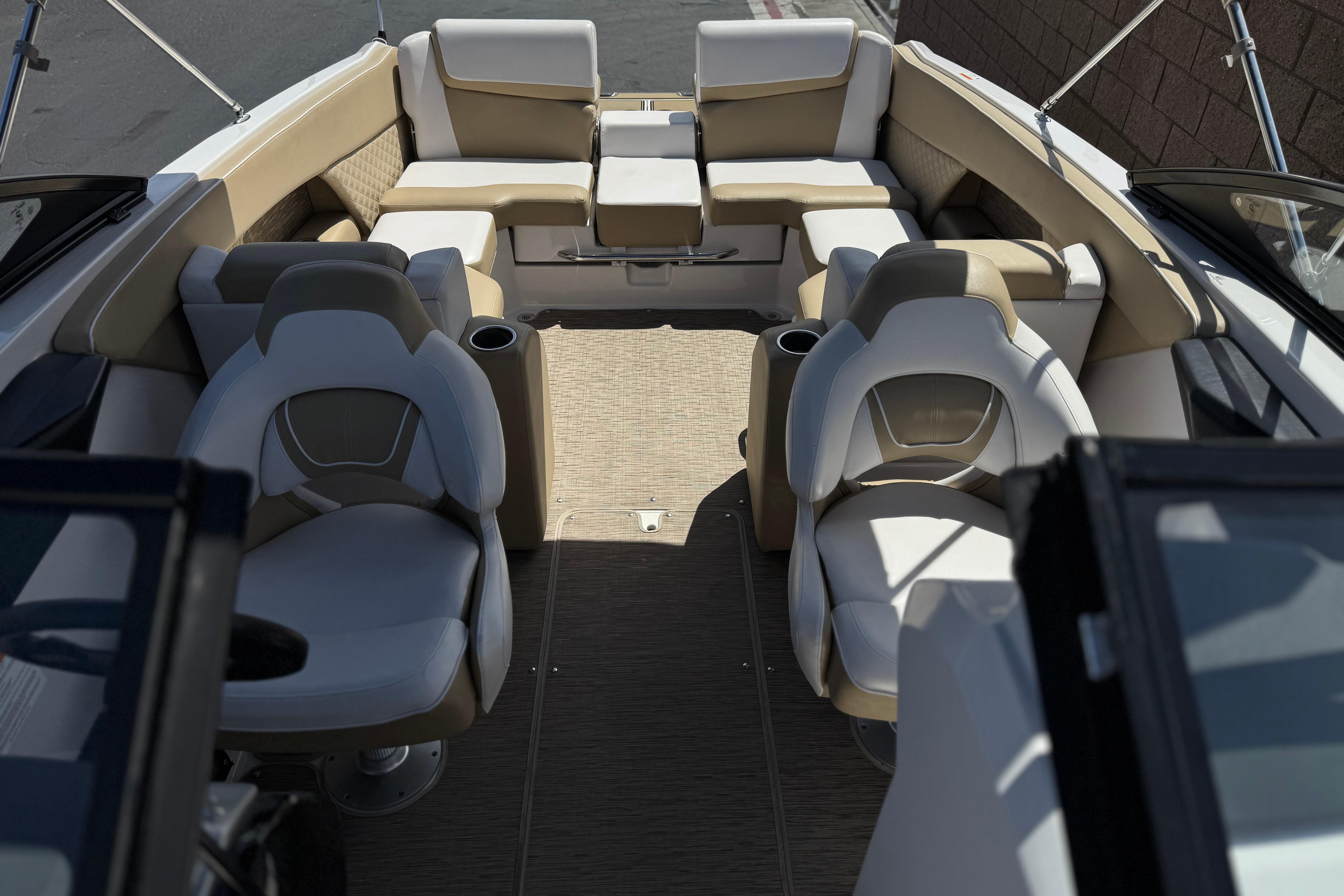 Interior of 2017 Scarab 255 H.O. Platinum boat with beige and white seating.