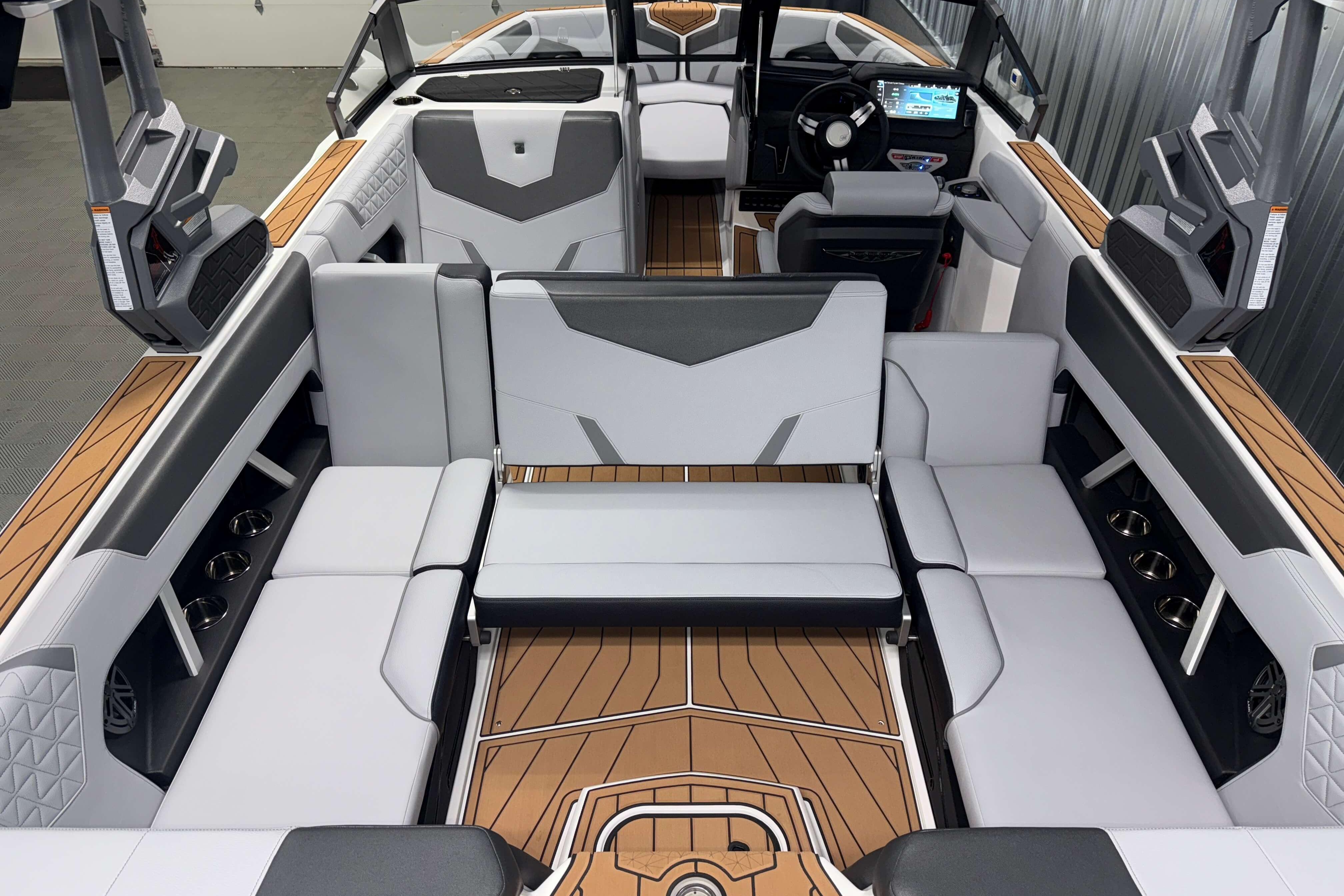 2026 Nautique Super Air Nautique GS22 interior with luxurious seating and modern dashboard.