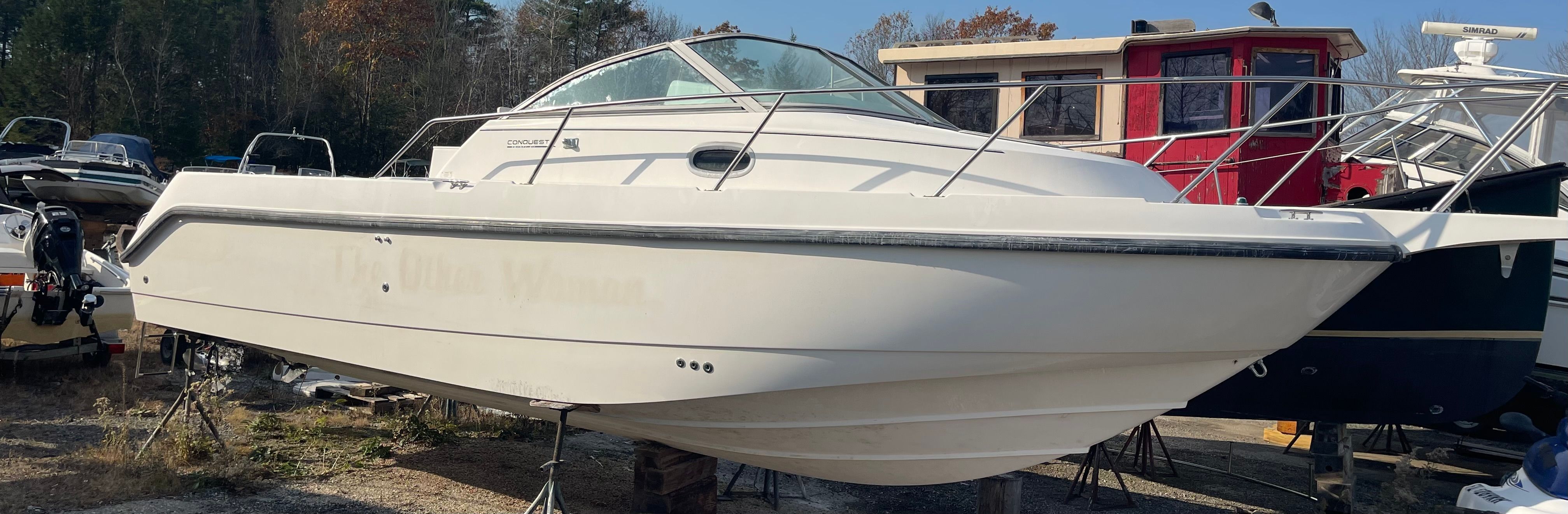 2001 Boston Whaler 26 Conquest on a boatyard.