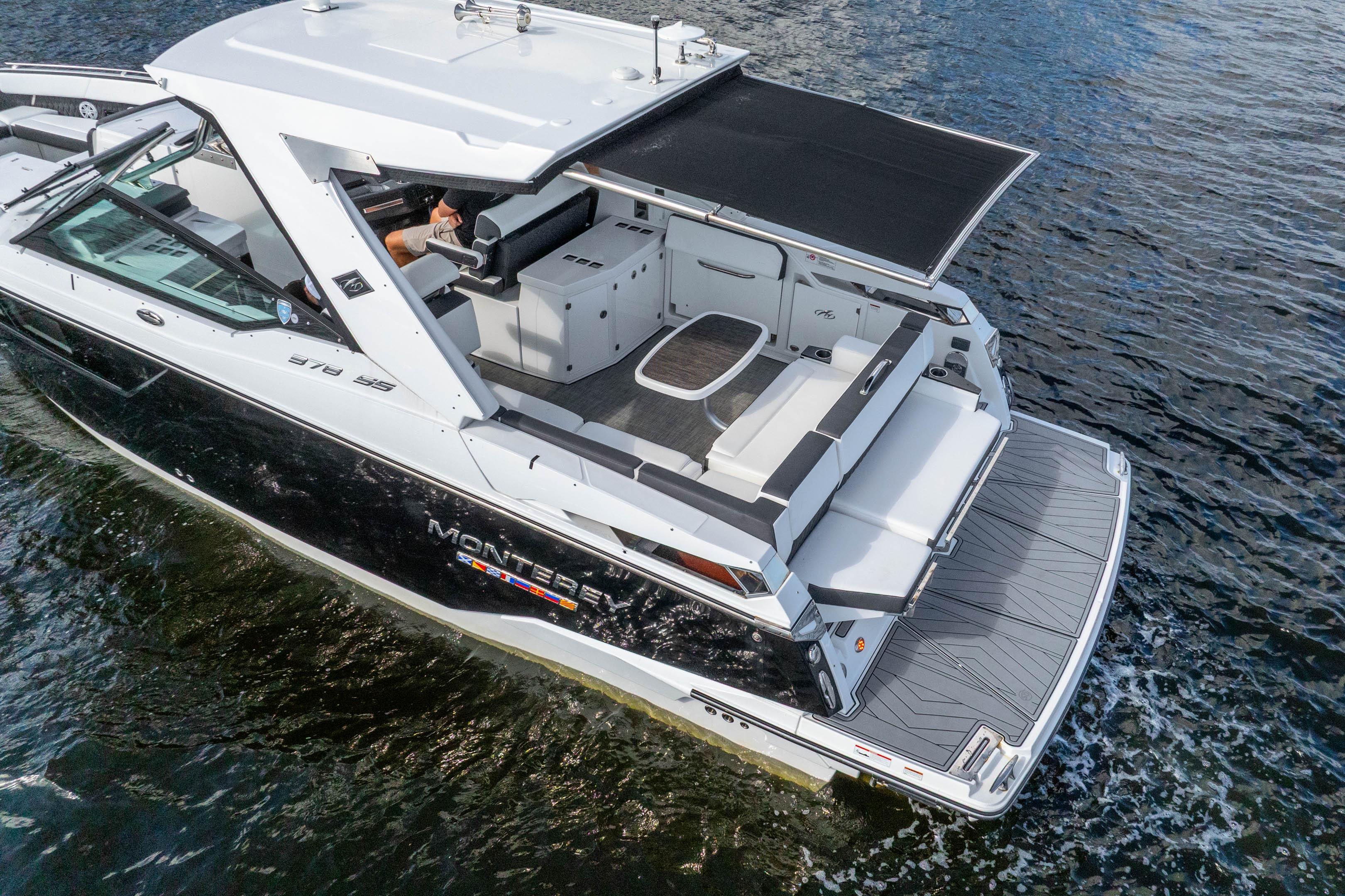 2022 Monterey 378SS Super Sport boat cruising on water, featuring spacious deck and seating.