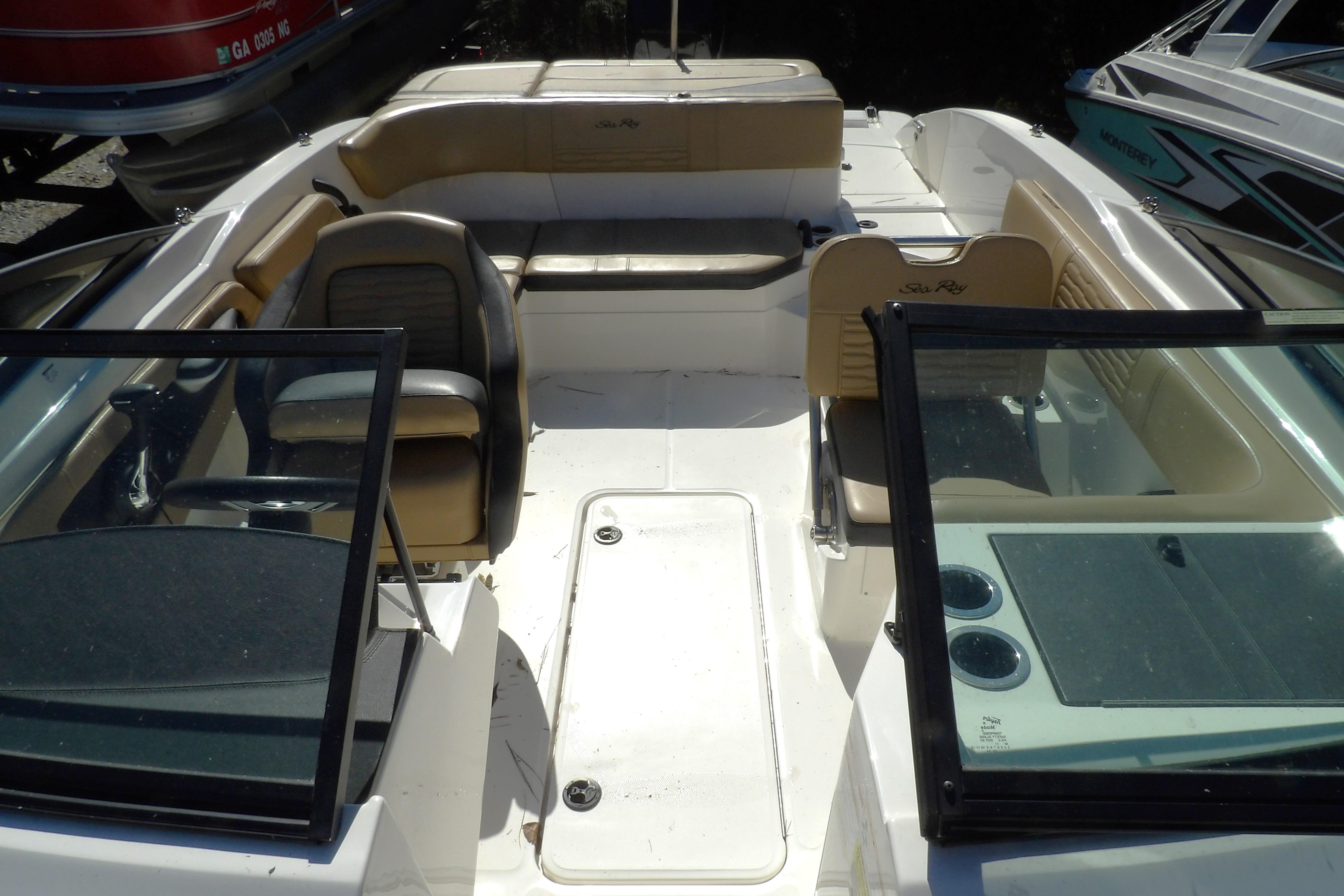 2023 Searay 210 SPO boat interior with seating and steering wheel.