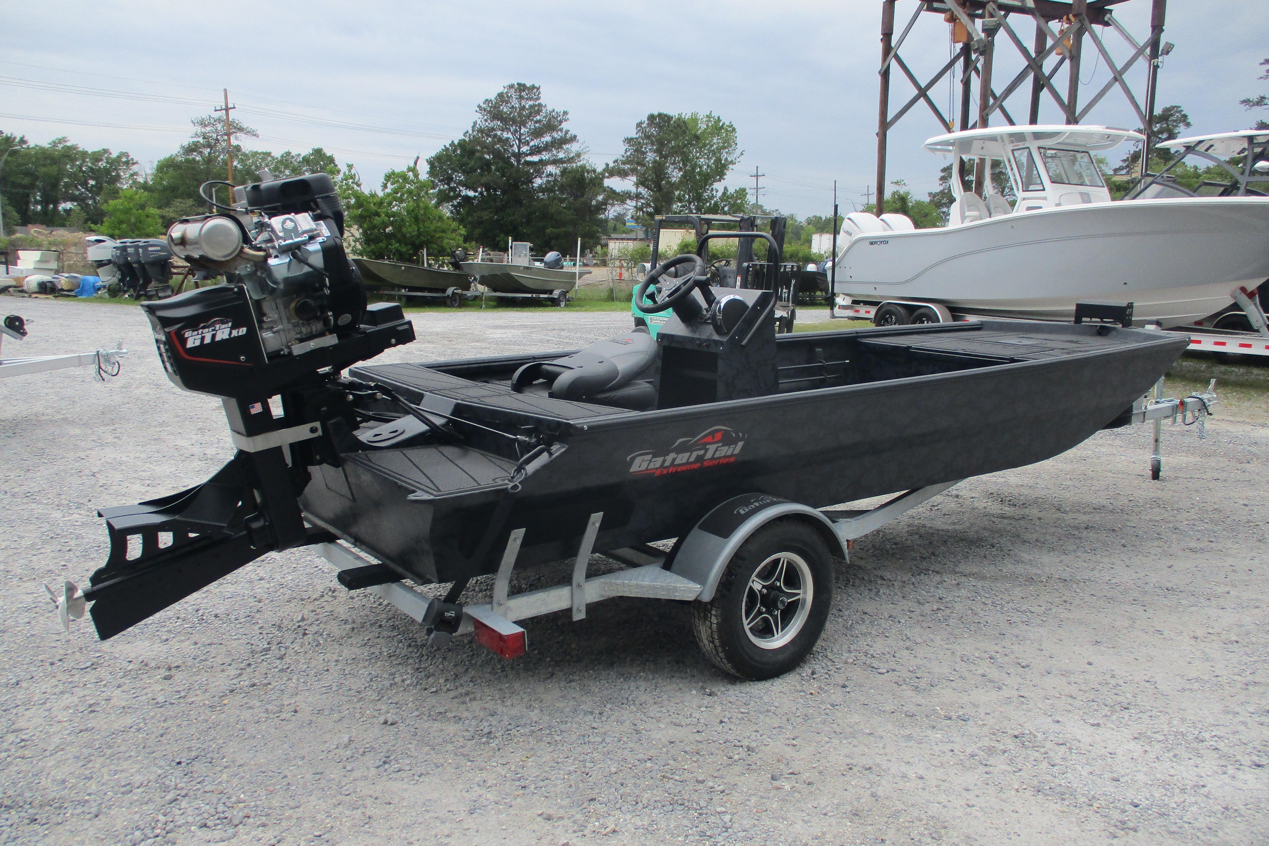 2026 Gator Tail 1860 Extreme CC boat on trailer, parked outdoors.