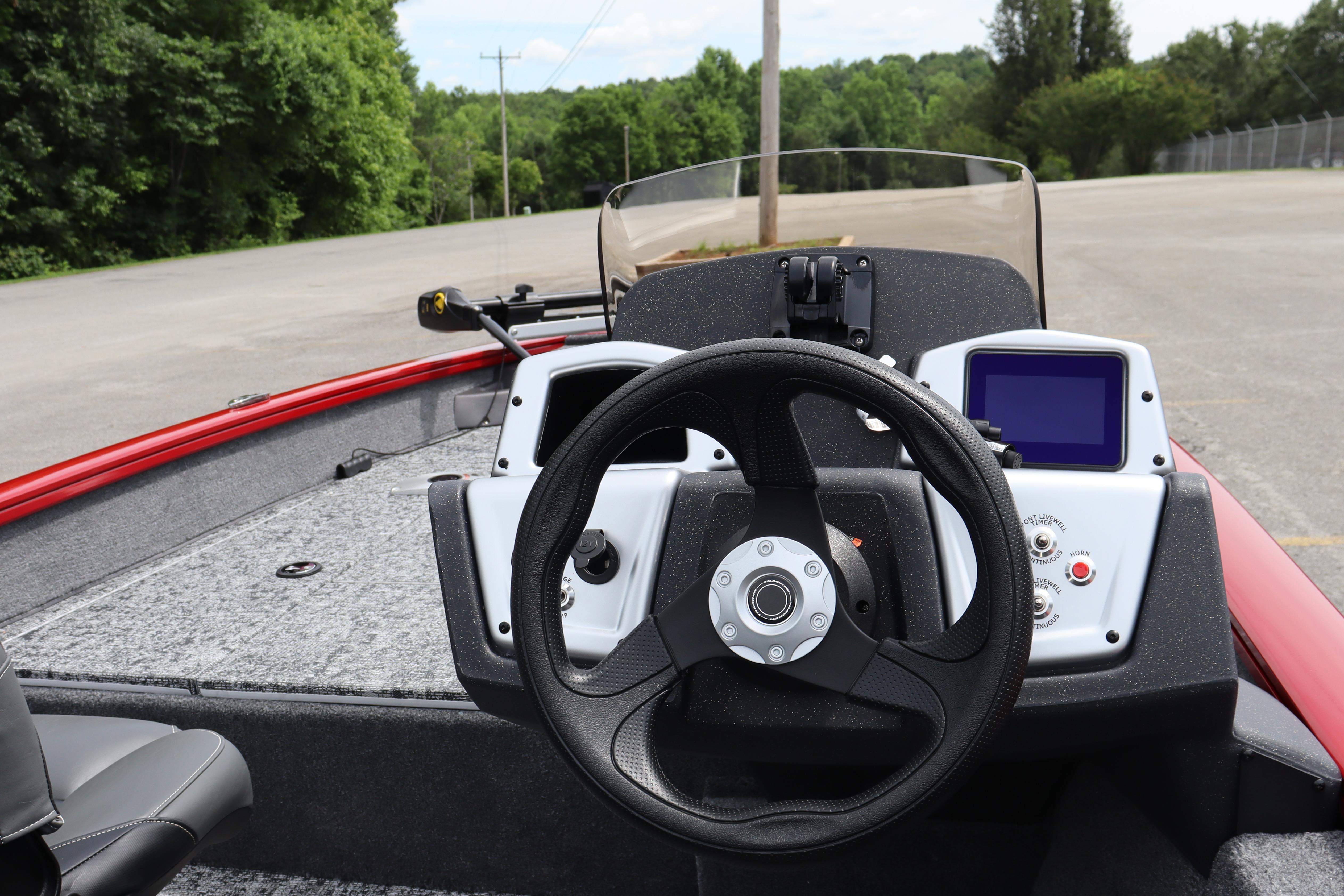 2026 Tracker Pro Team 175 Crappie Edition boat dashboard with steering wheel and controls.