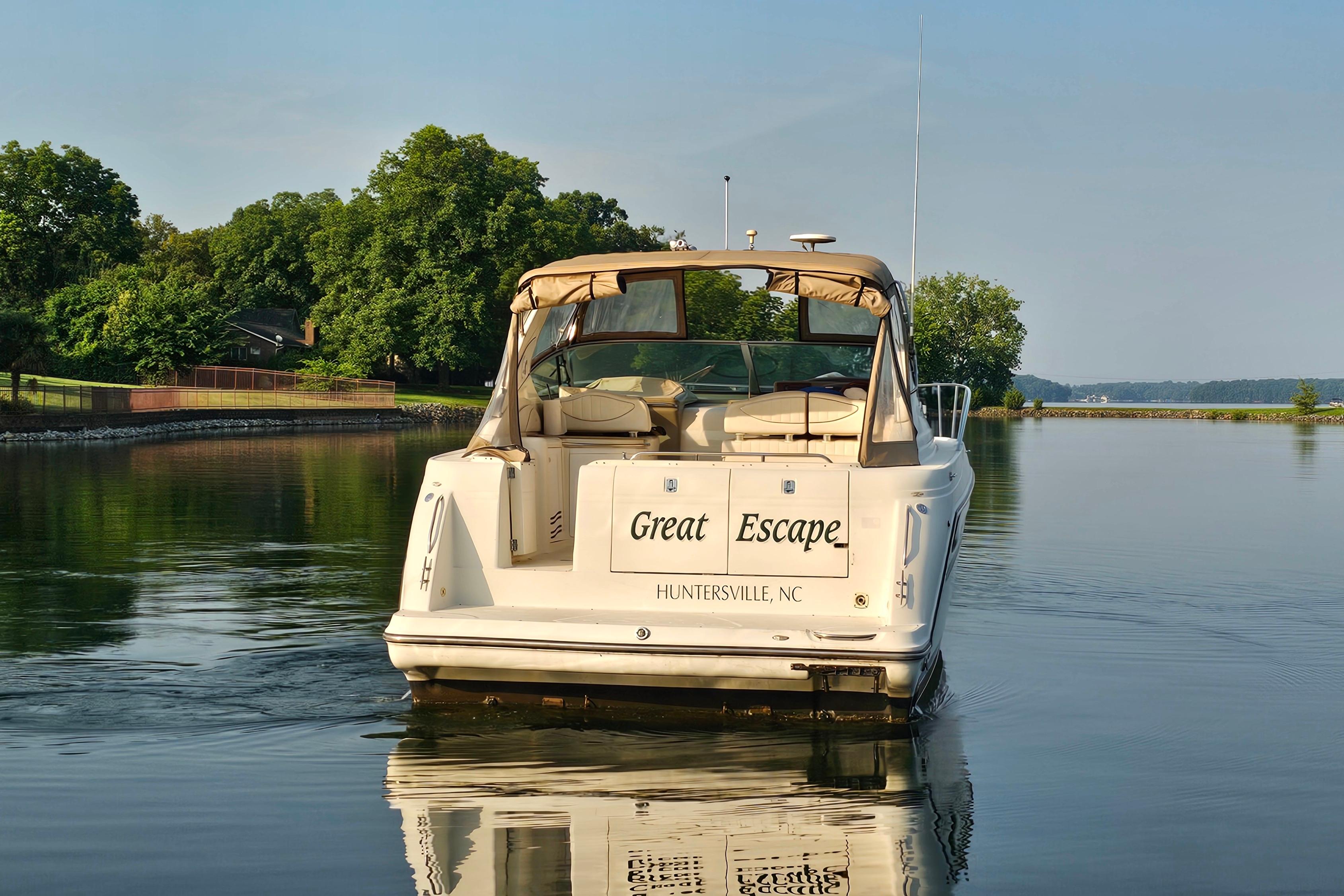 1998 Maxum 3700 SCR boat named "Great Escape" on calm water, Huntersville, NC.