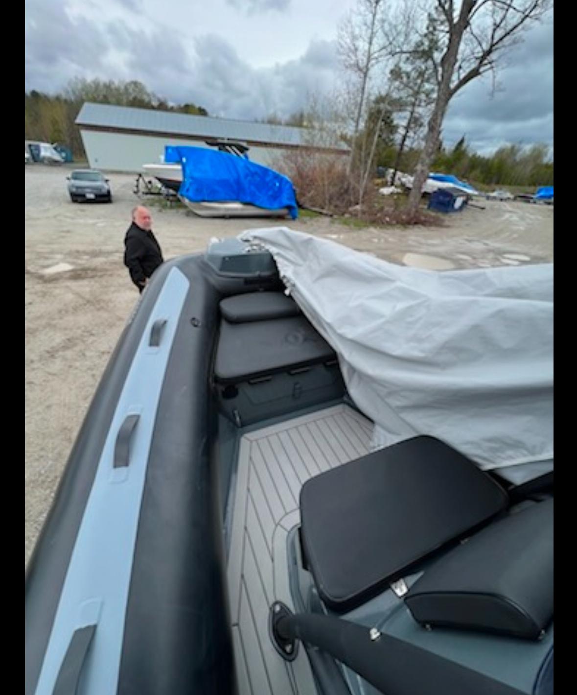 2022 Gala V650F boat partially covered, parked outdoors with overcast sky.
